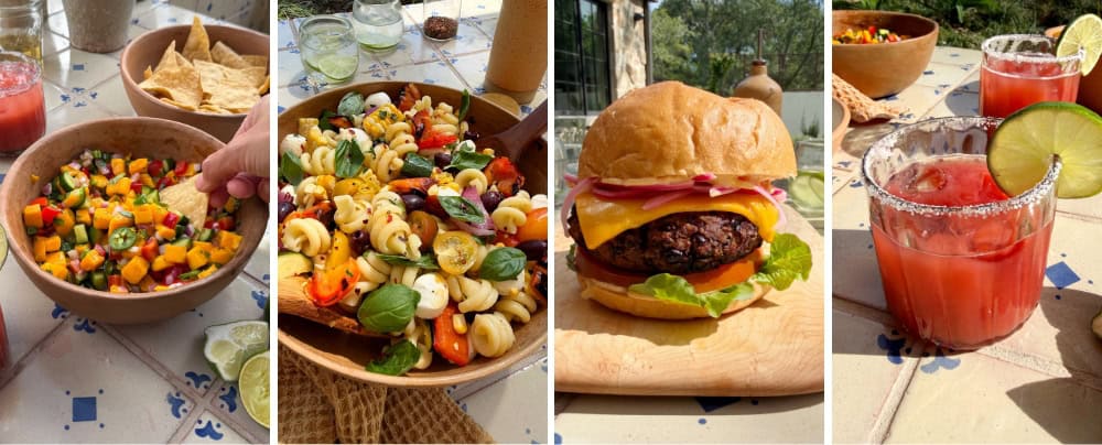 A row of four summer cookout dishes: mango salsa, grilled vegetable pasta salad, a black bean burger, and strawberry margaritas