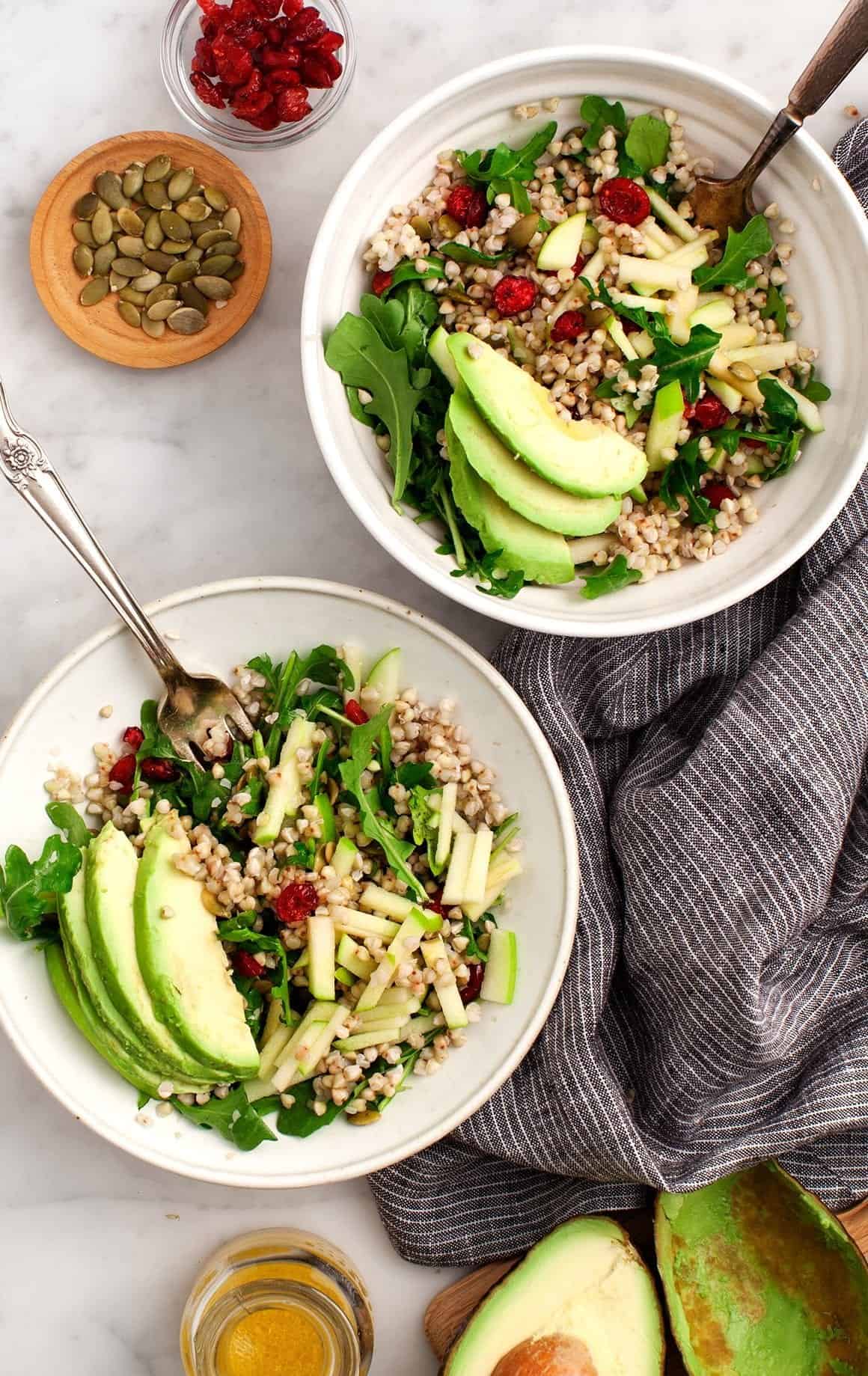 Buckwheat, Apple, Cranberry Avocado Salad in bowls with forks