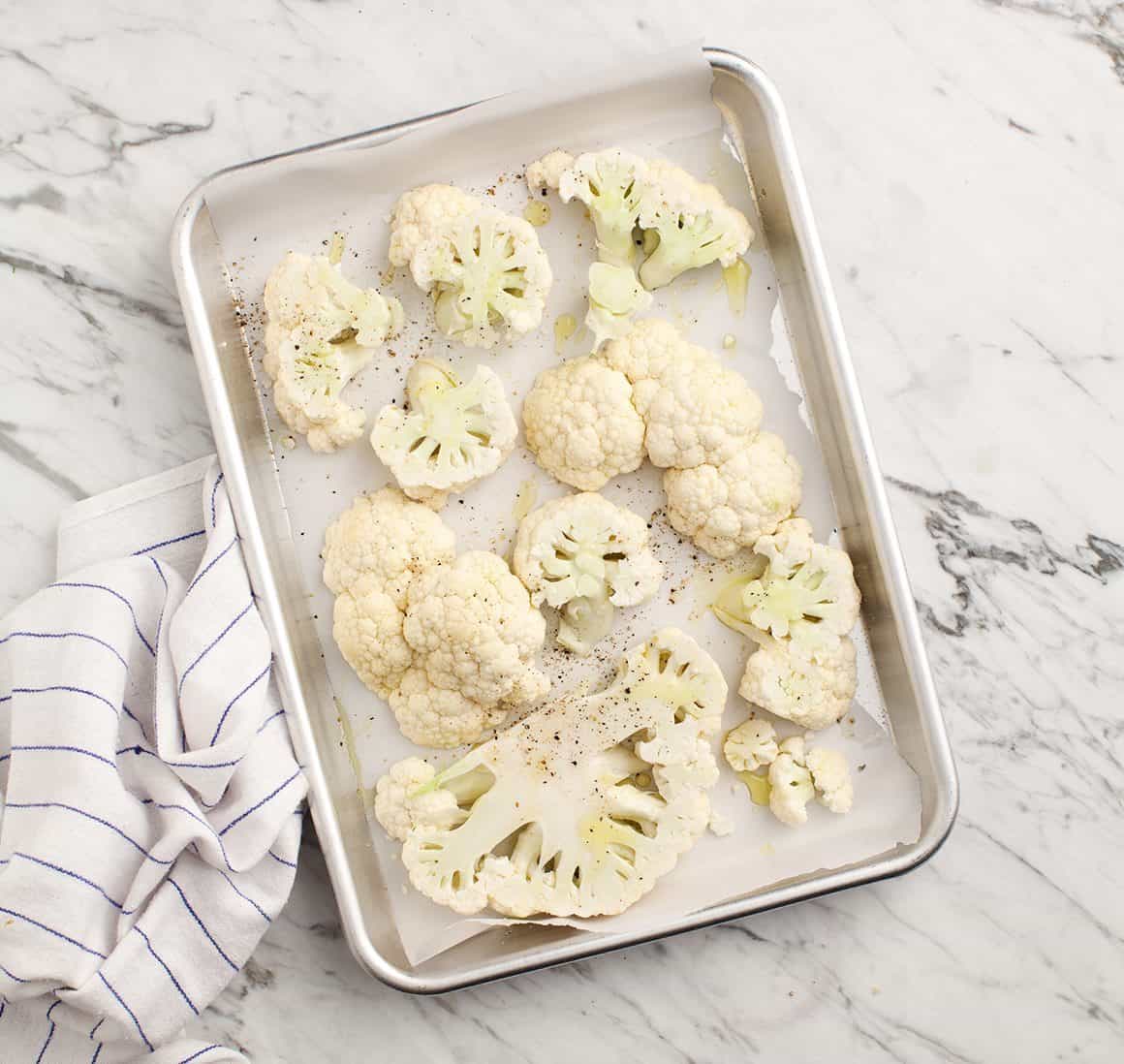 Romesco Cauliflower Sandwiches Cauliflower florets on a baking sheet
