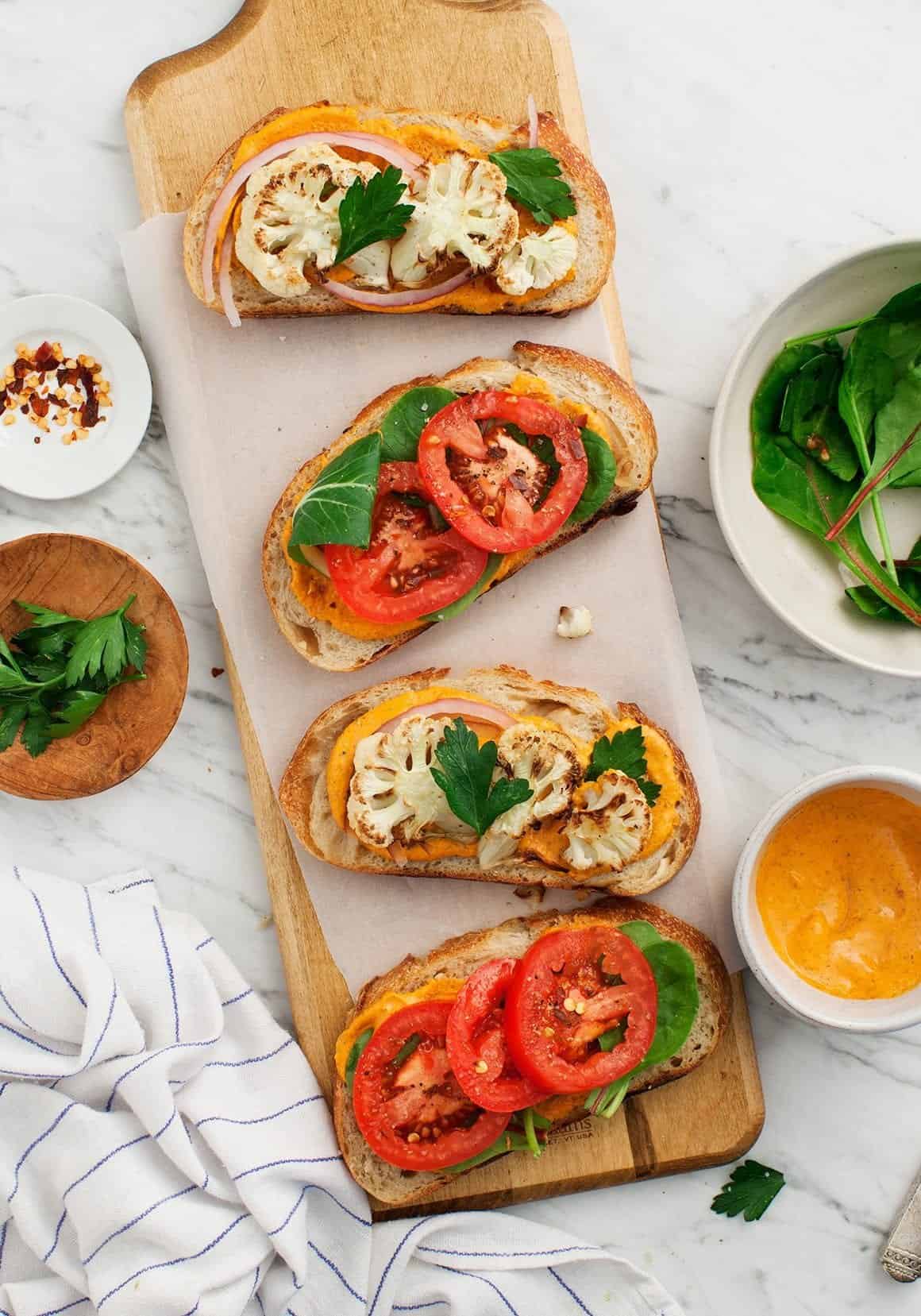 Romesco Cauliflower Sandwiches open on a board