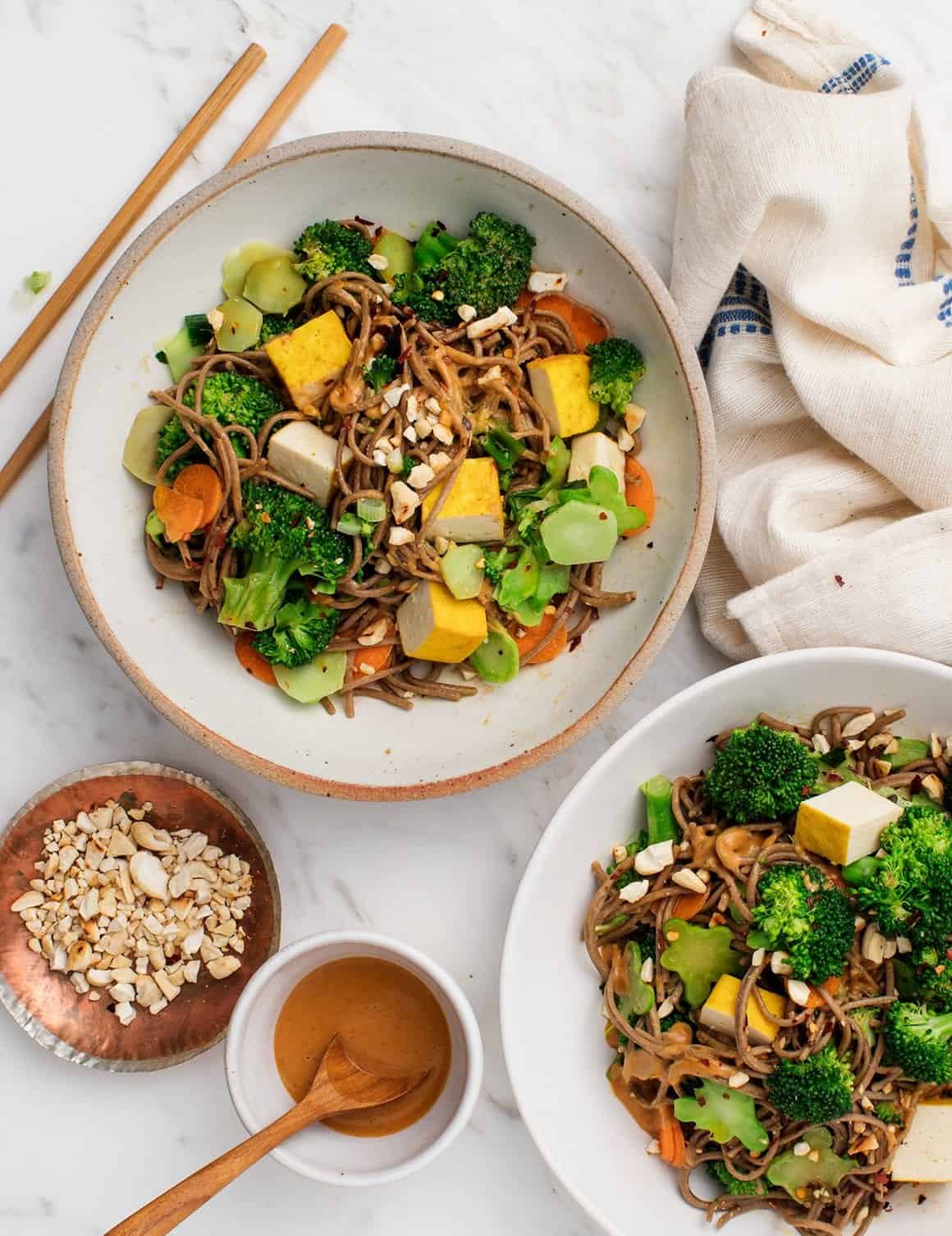 Cashew Broccoli Soba Noodles in bowls with chopsticks