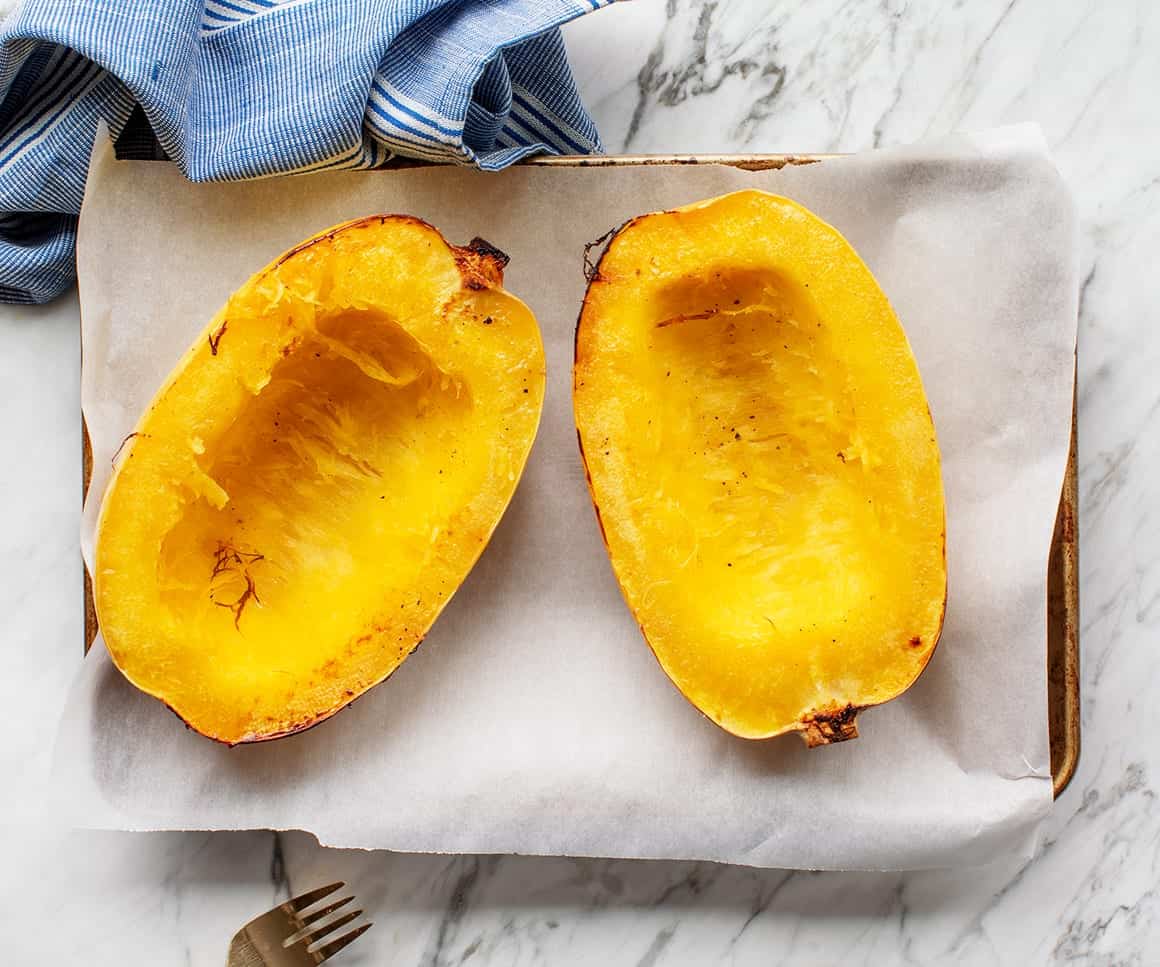 Roasted Spaghetti Squash halves on baking sheet