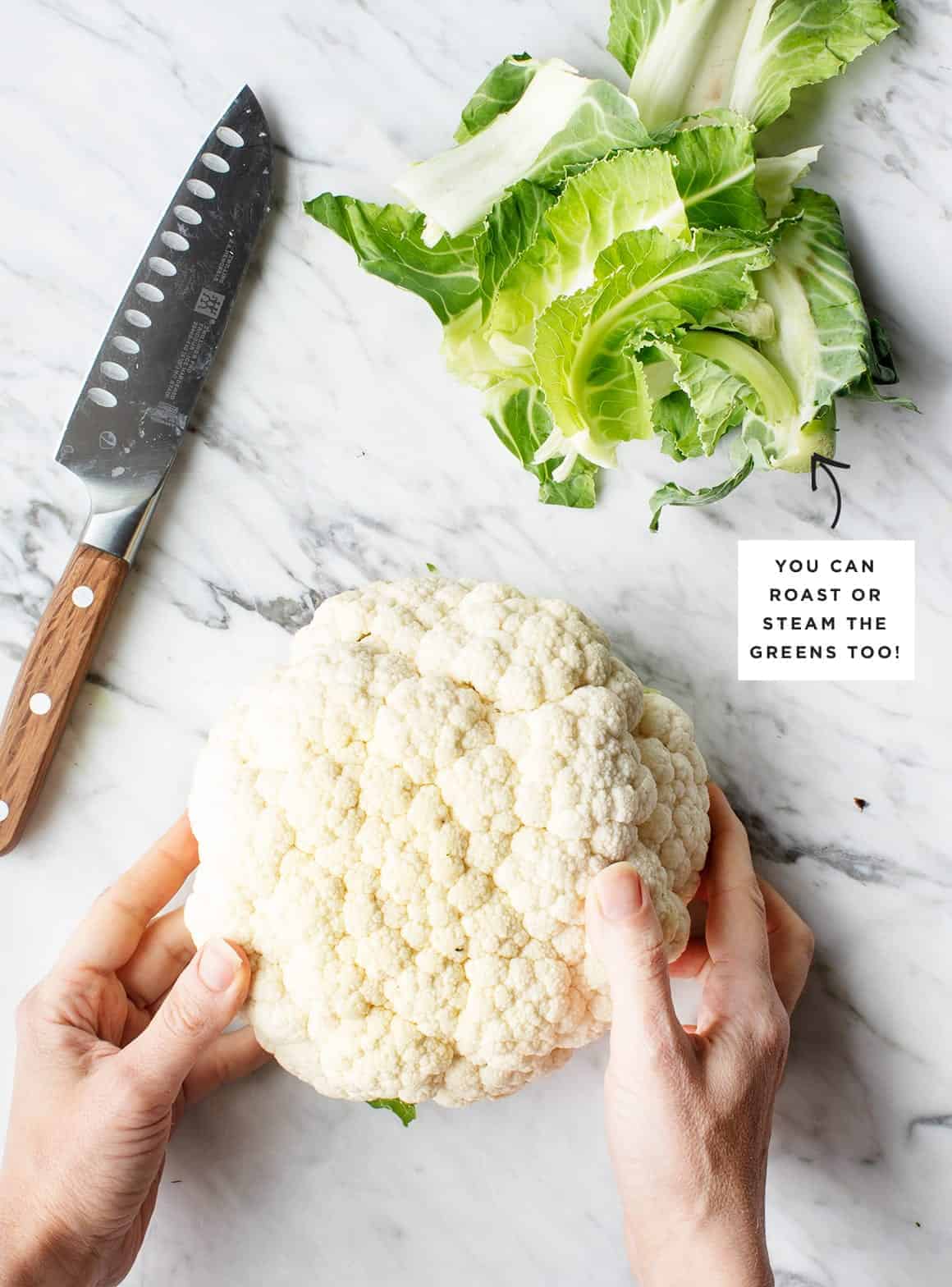 hands holding cauliflower