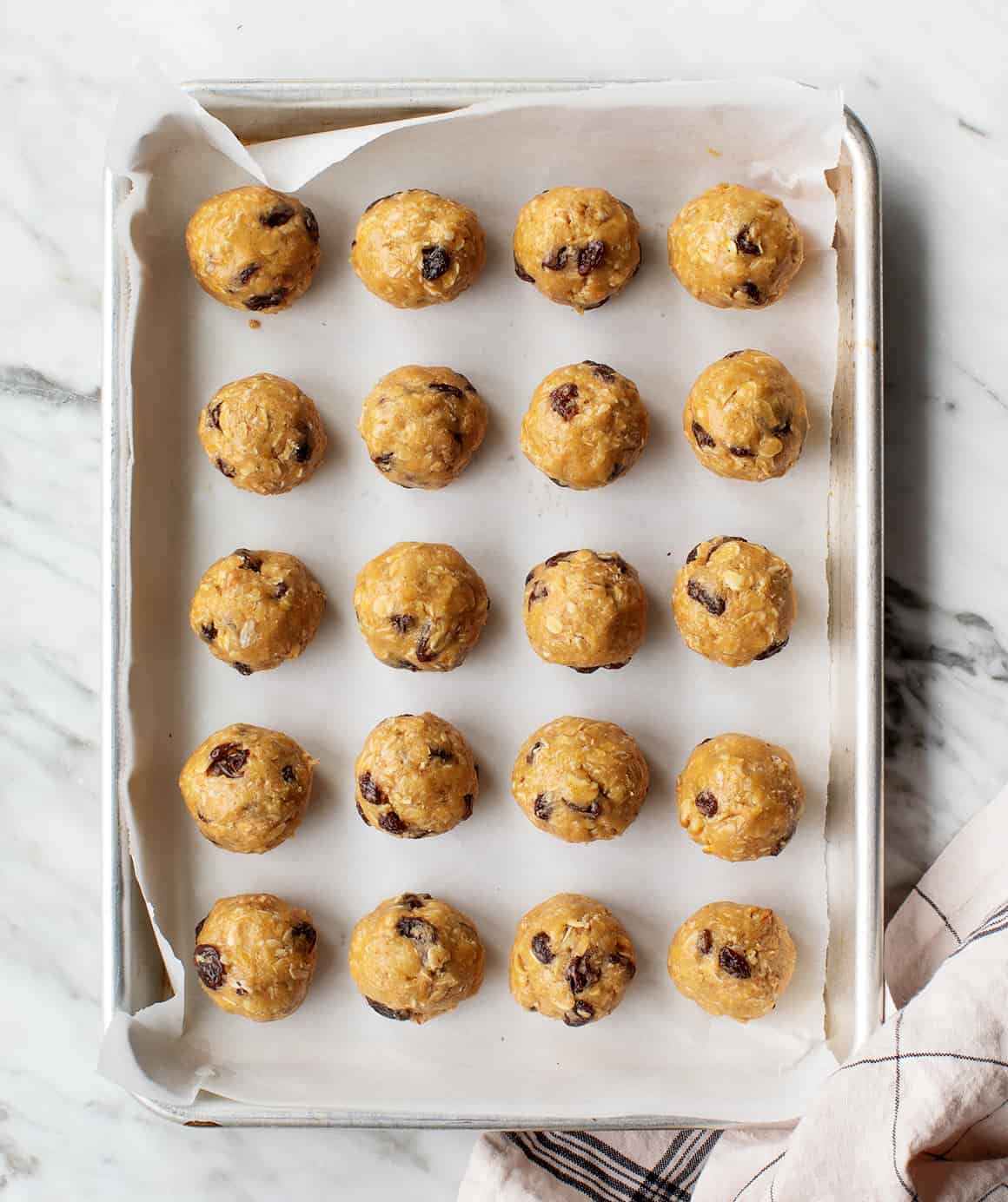 Oatmeal raisin cookies on a baking sheet