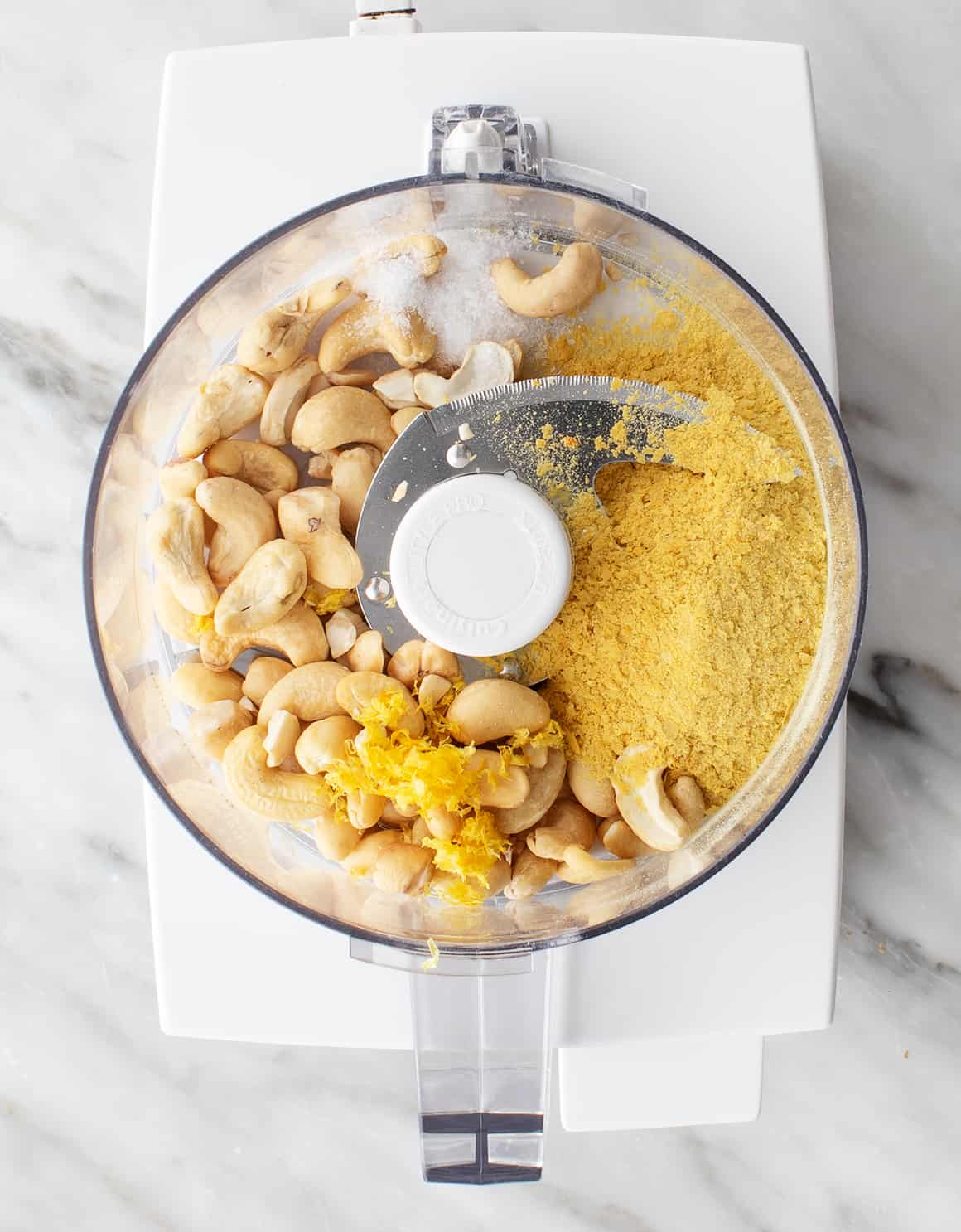 Cashews and nutritional yeast in a food processor