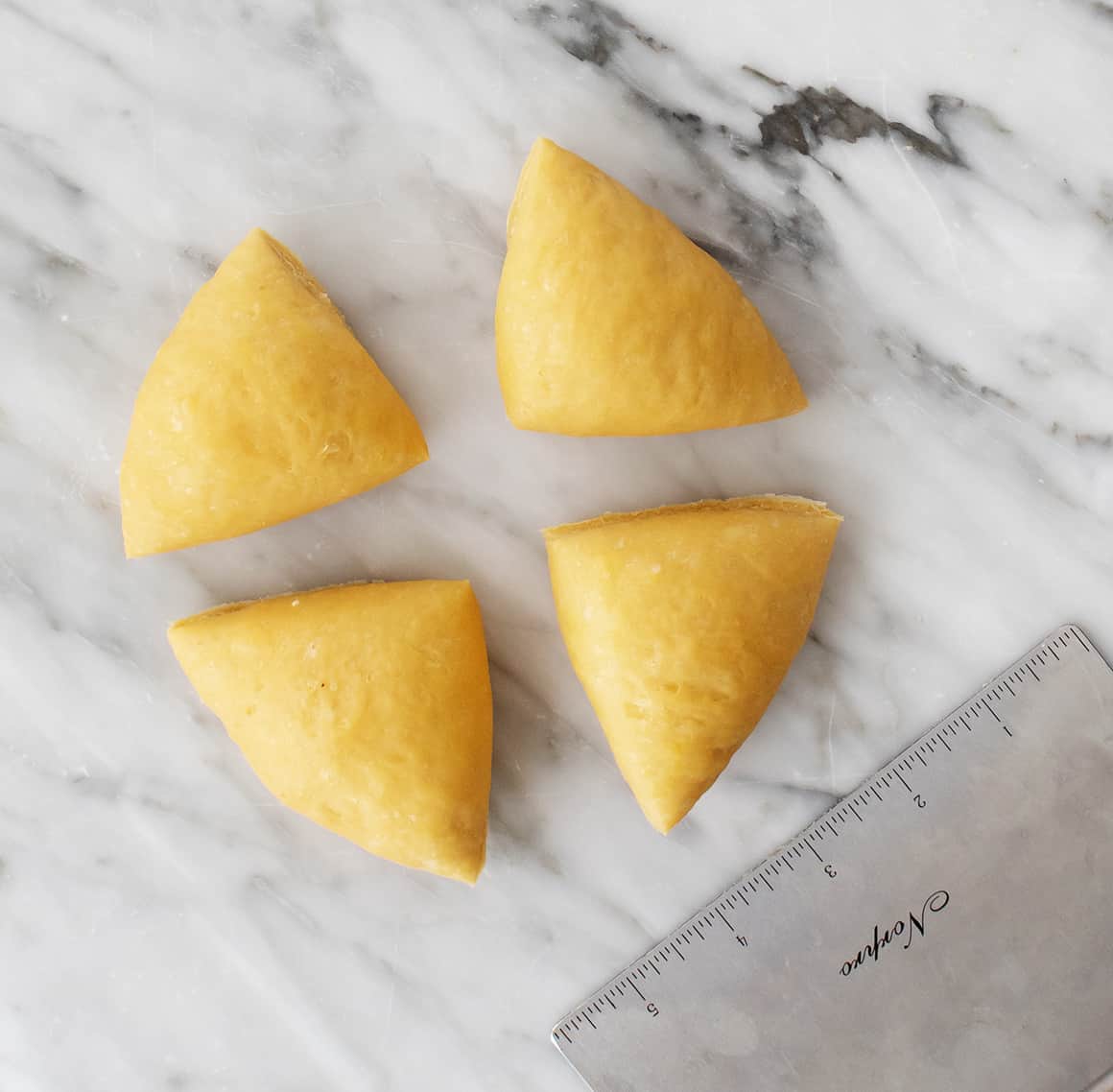 Fresh pasta dough cut into 4 pieces