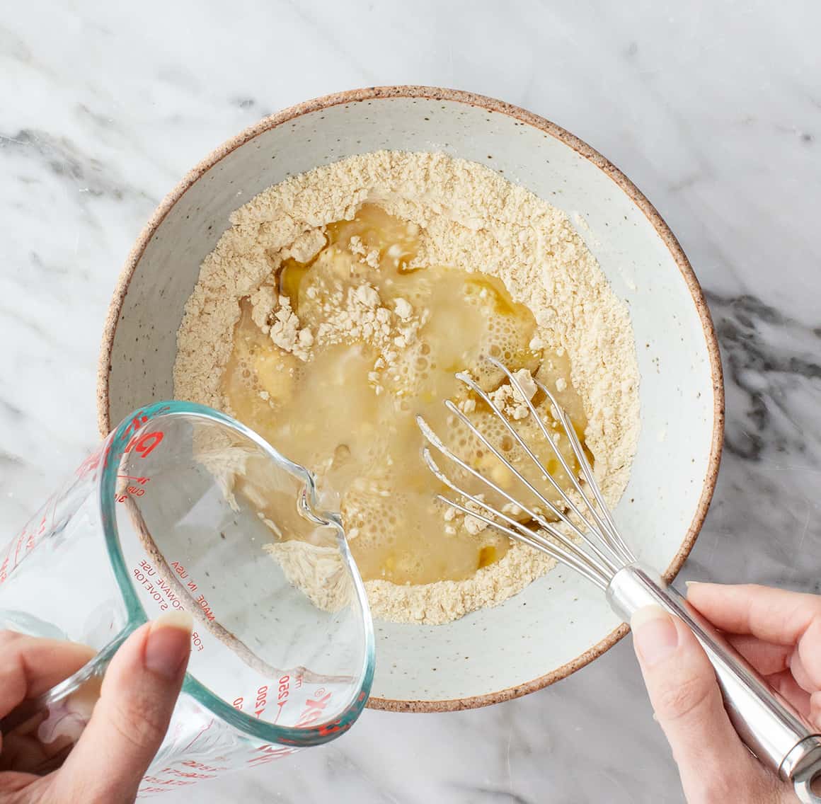 Chickpea flour and water in a mixing bowl