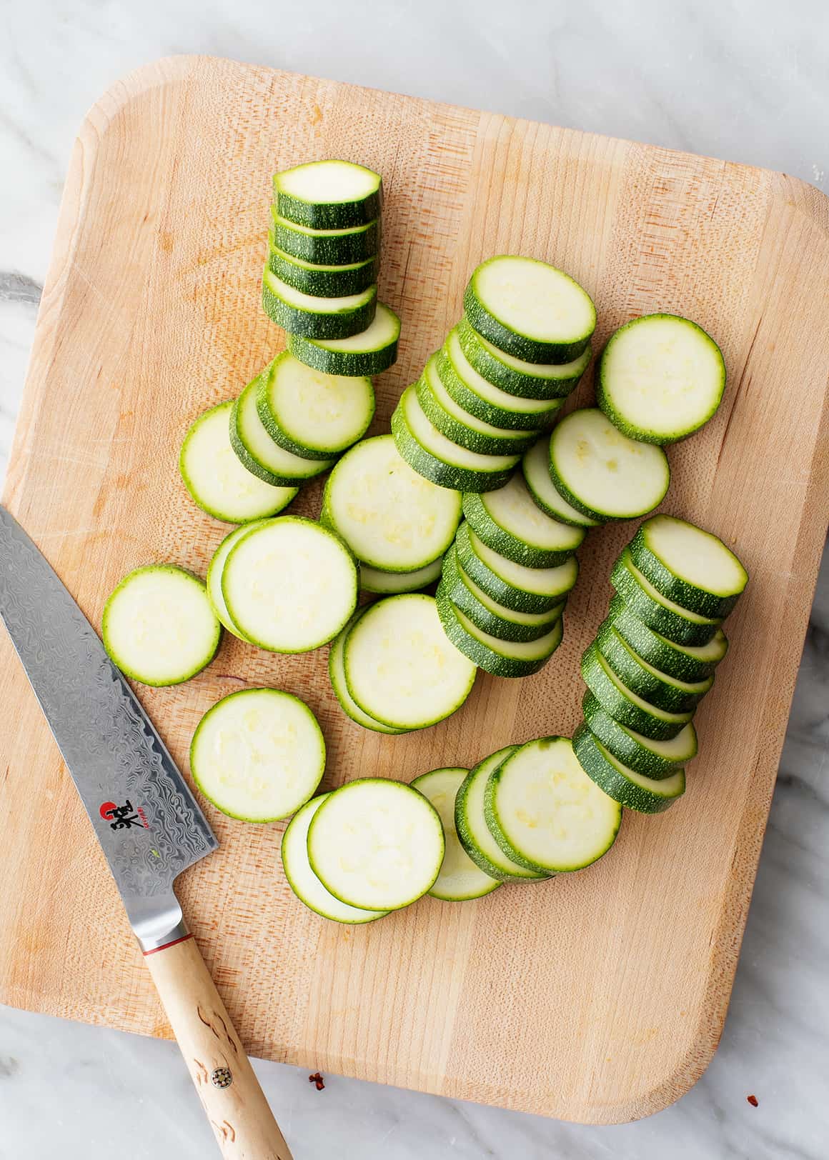 Zucchini slices on a cutting board