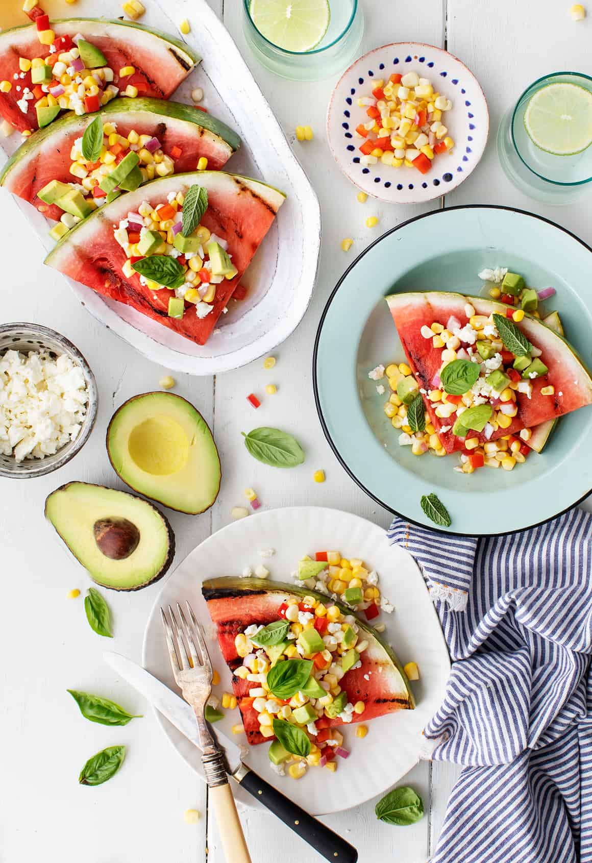 Grilled watermelon steaks on plates