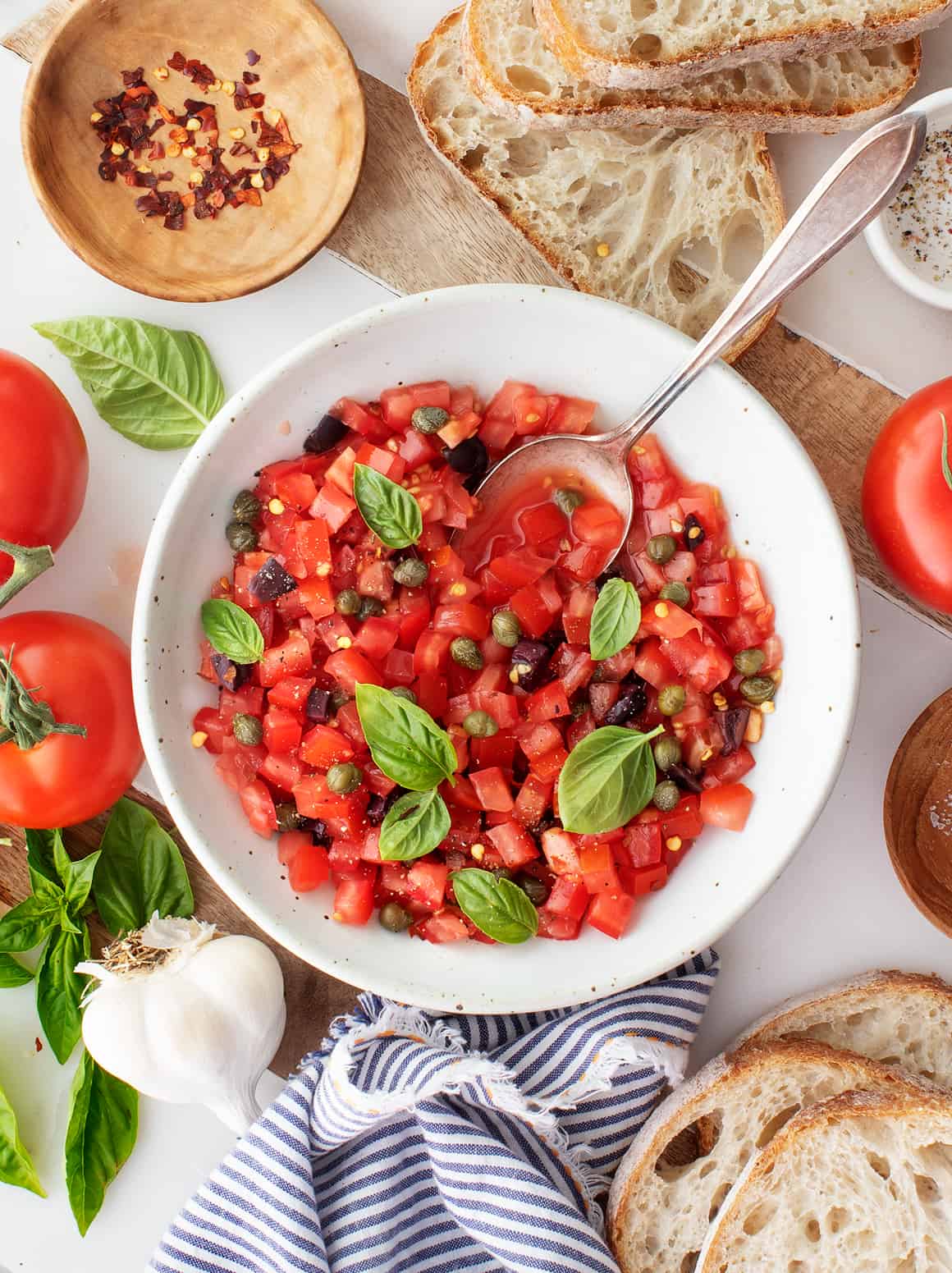 Diced tomatoes in a bowl with bread