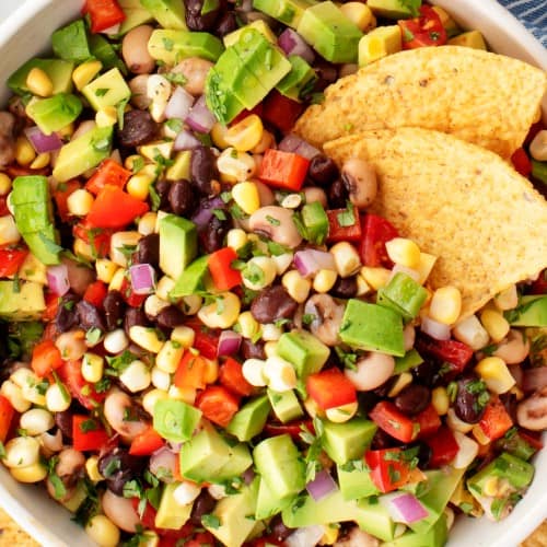 Cowboy caviar with black beans, corn, tomatoes and avocado