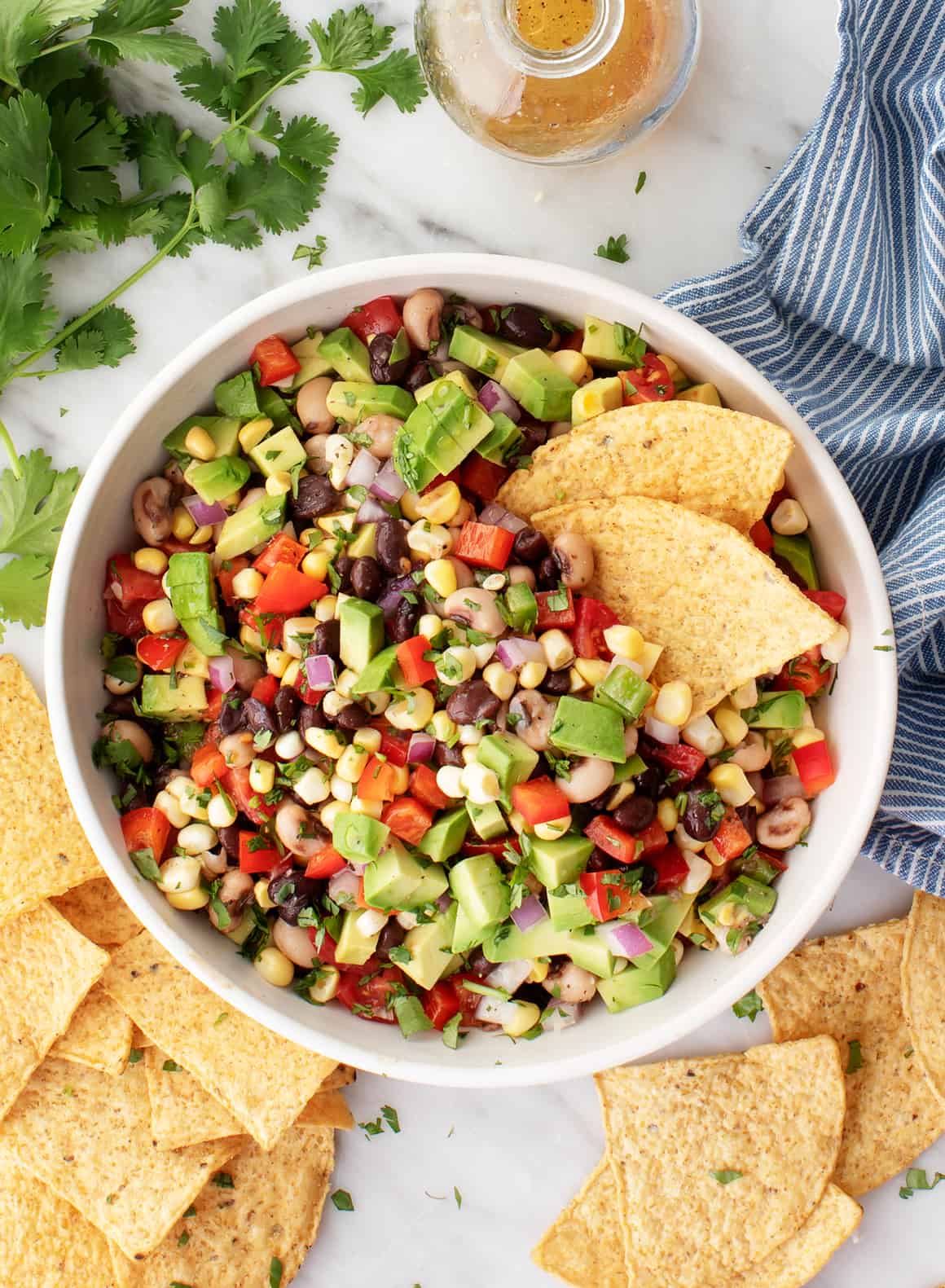 Bowl of cowboy caviar with tortilla chips - easy summer appetizers