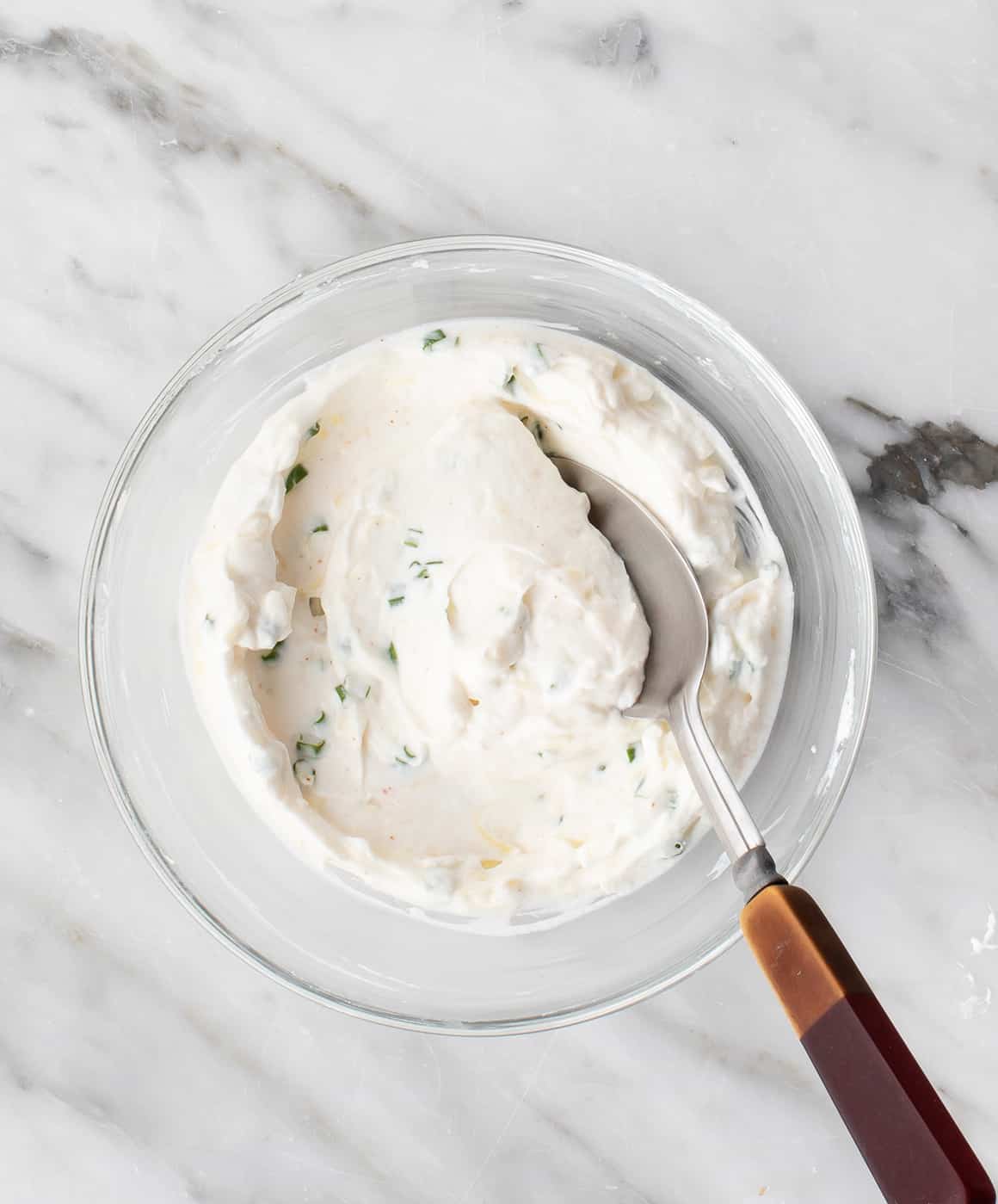 Bowl of creamy filling for homemade jalapeno poppers