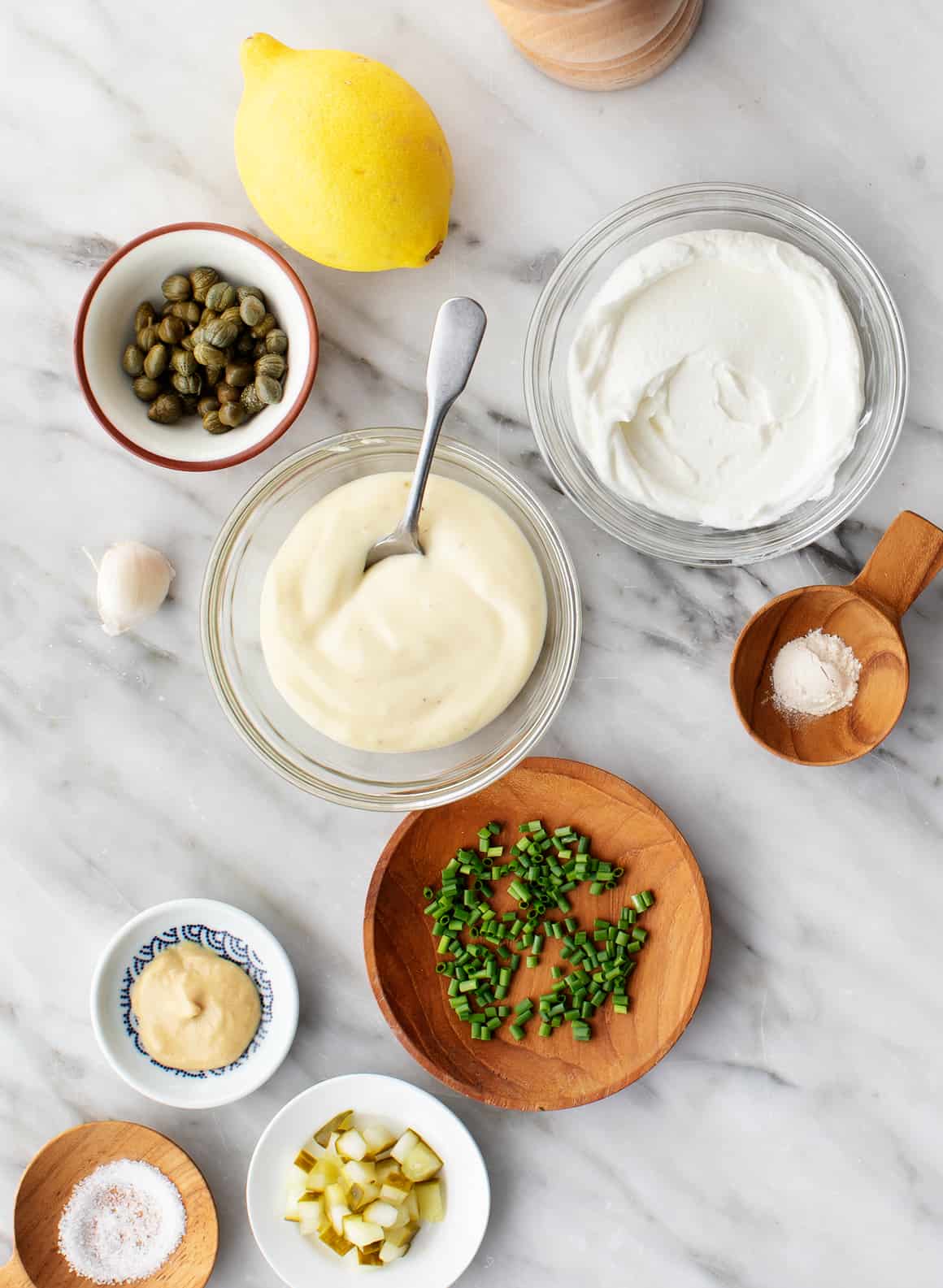 Yogurt, mayonnaise, capers, chives, mustard, lemon, garlic, and onion powder