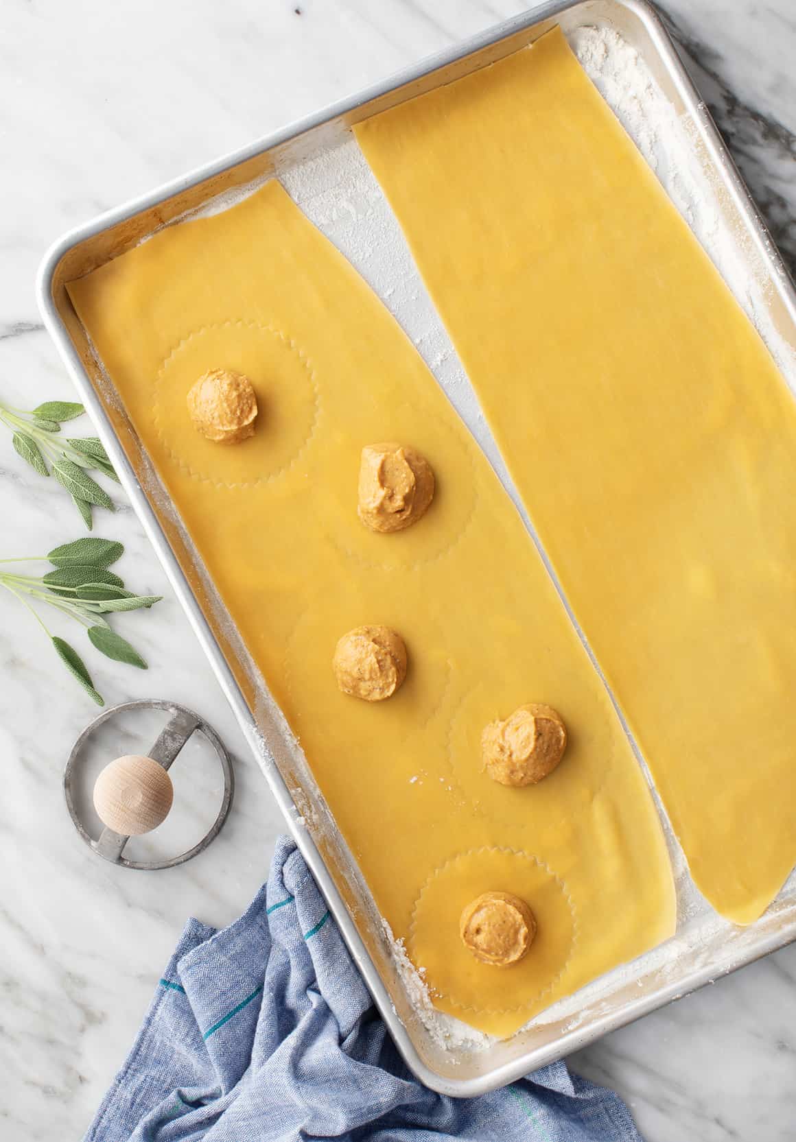 Homemade pasta sheets on a baking sheet