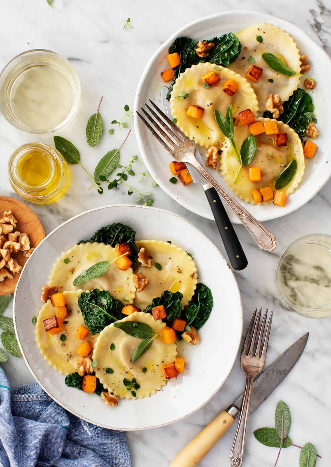 Two plates of butternut squash ravioli