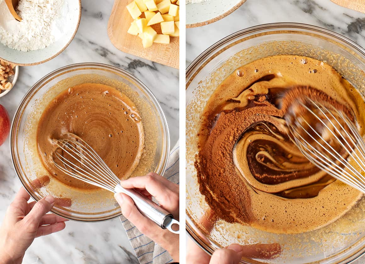 Hands whisking cake batter with a metal whisk