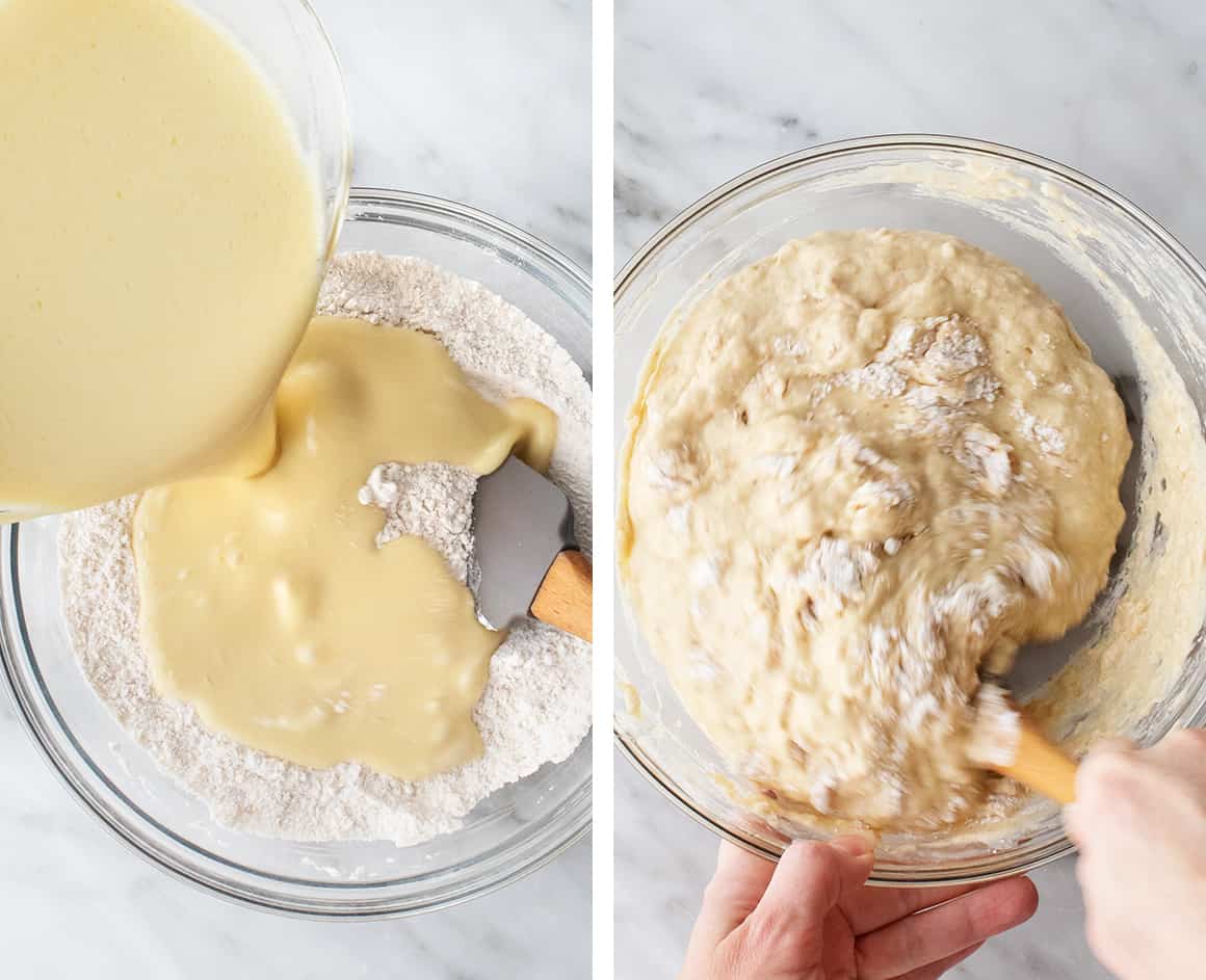 Hands folding wet and dry ingredients together with a spatula