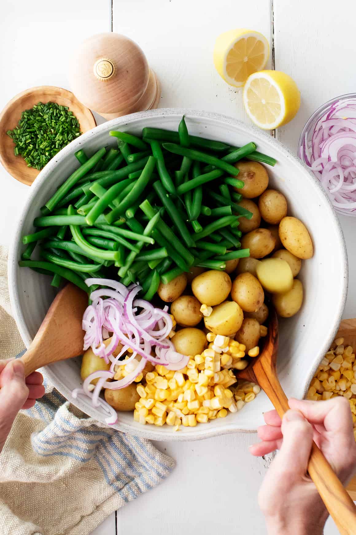 Vegan potato salad ingredients in a large bowl