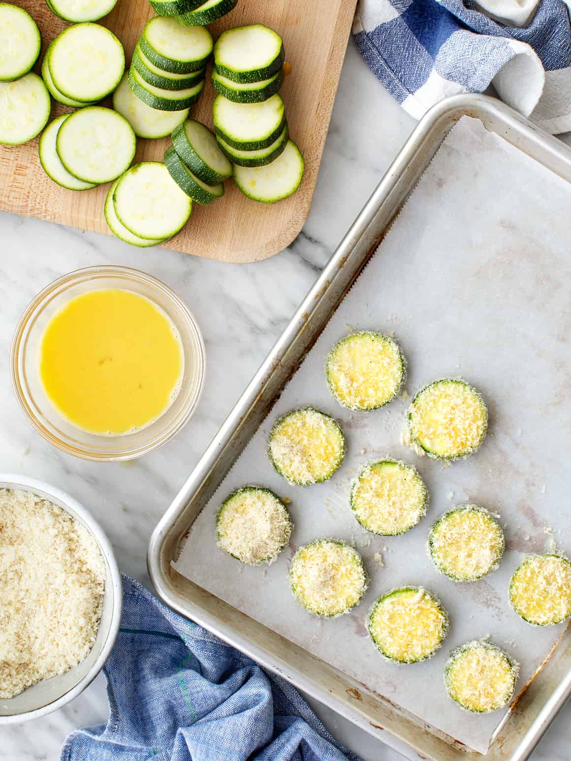 Breaded zucchini on a baking sheet