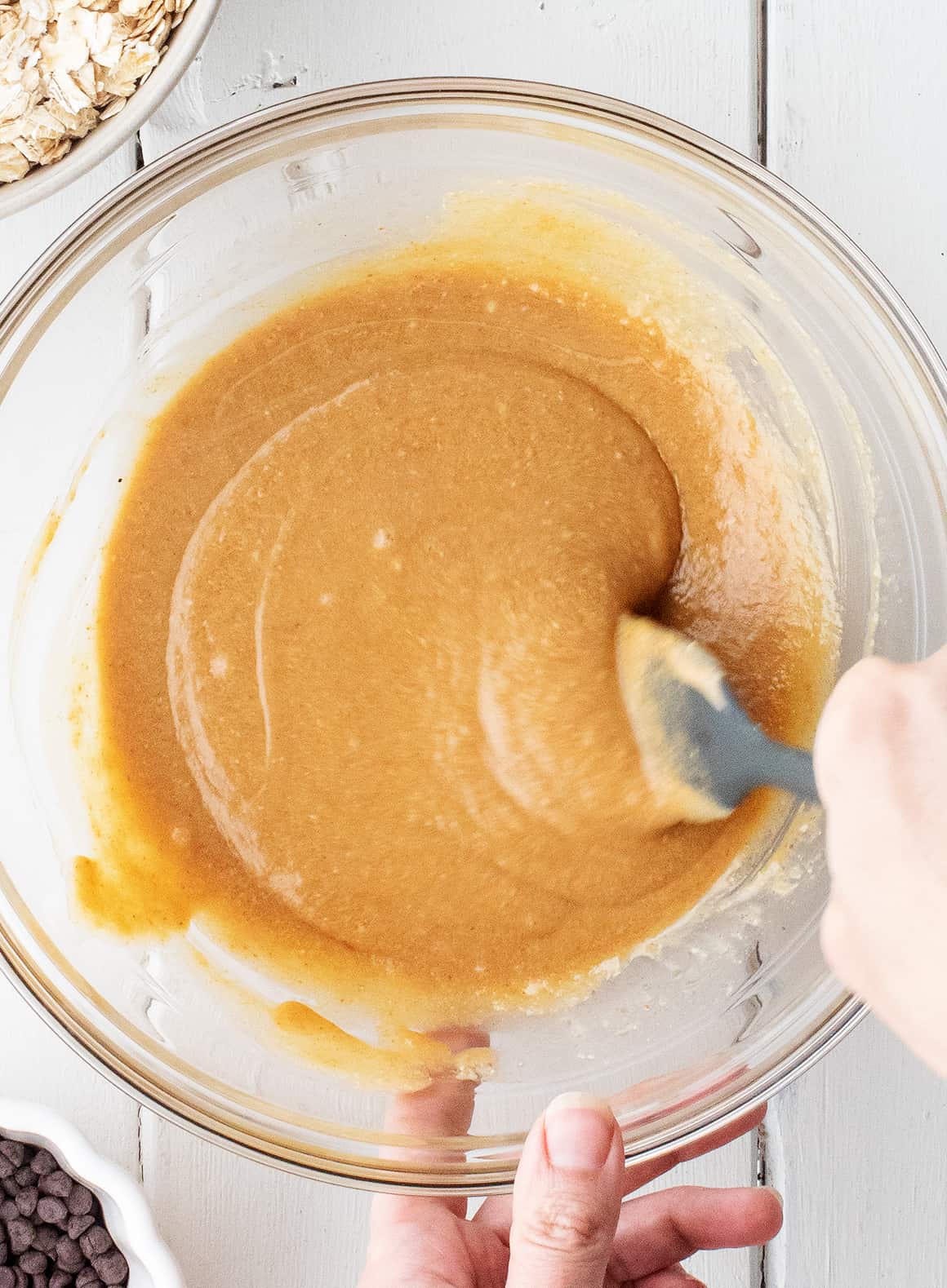 Stirring wet ingredients in a large bowl