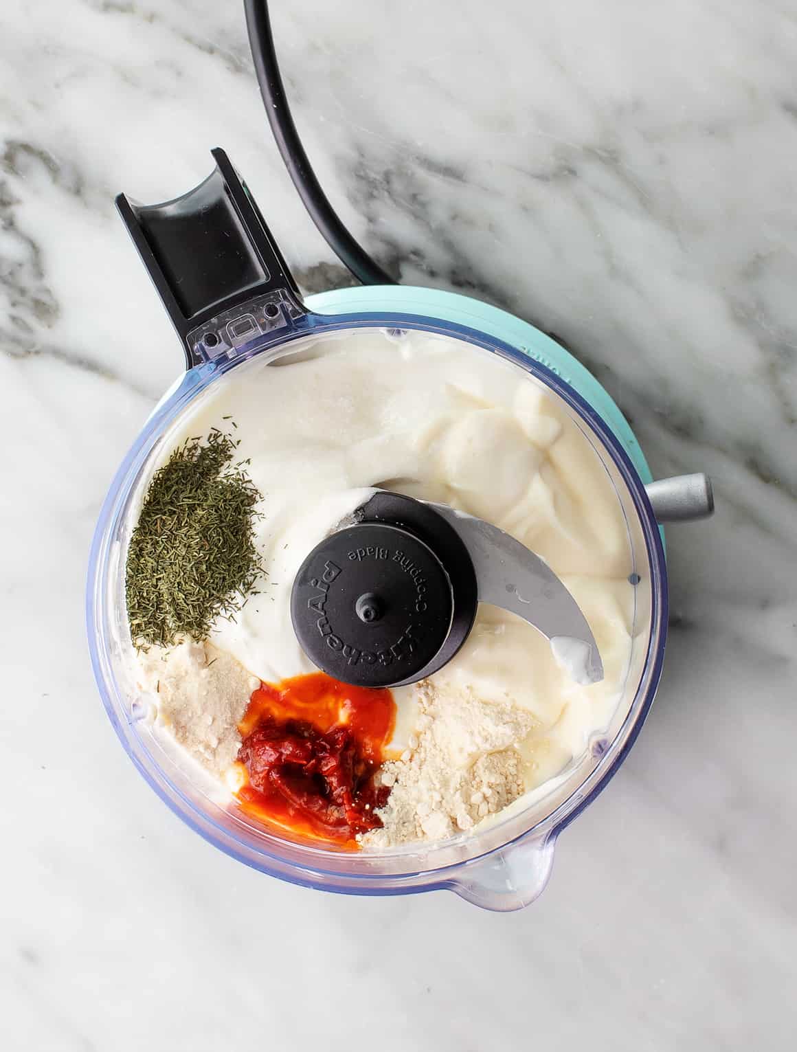Greek yogurt, mayo, chipotles, onion powder, garlic powder, and dried dill in a food processor
