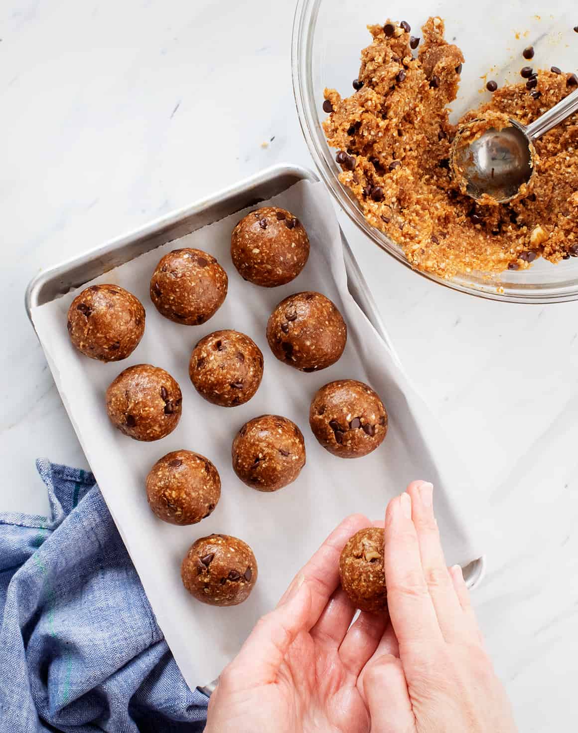 rolling energy ball dough into balls