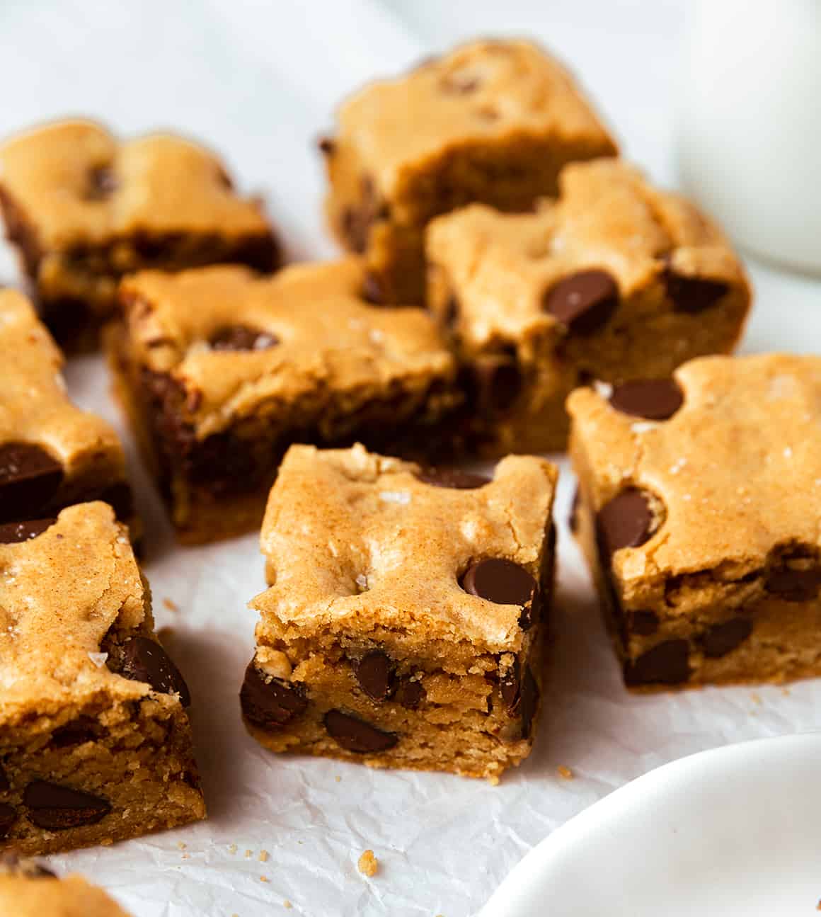Chocolate chip cookie bars on parchment paper