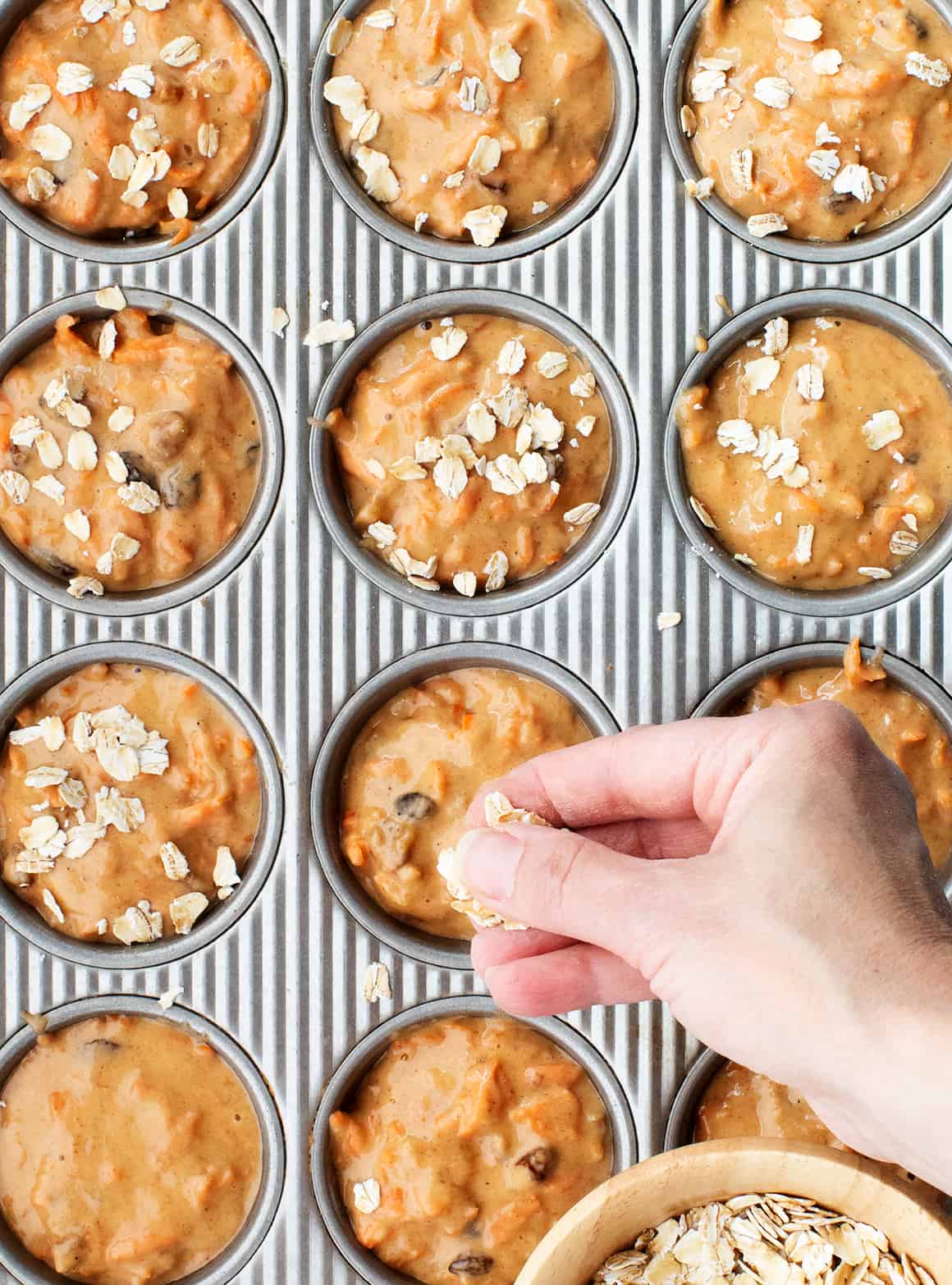 carrot muffin batter in muffin pan