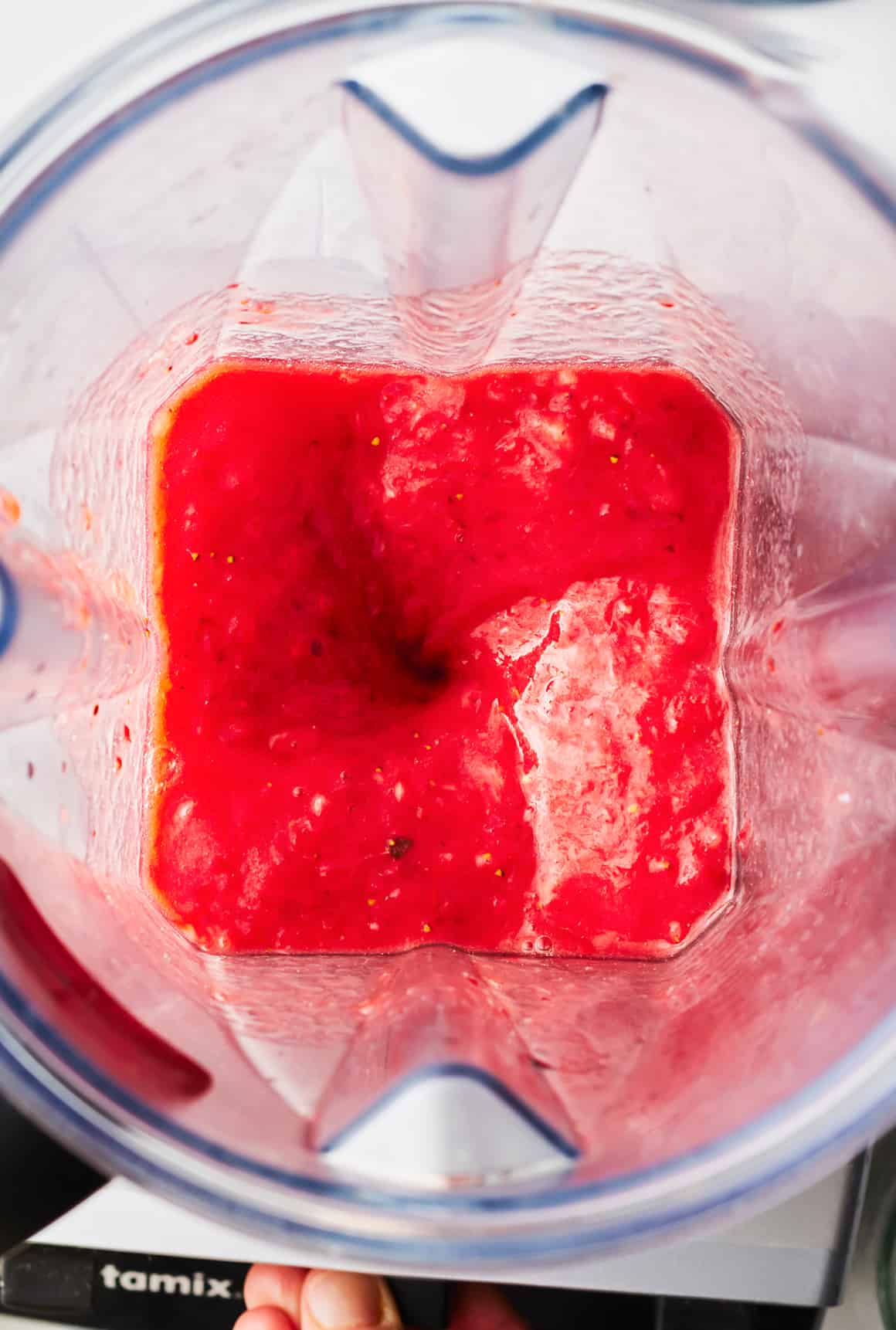 Blending strawberries in a blender