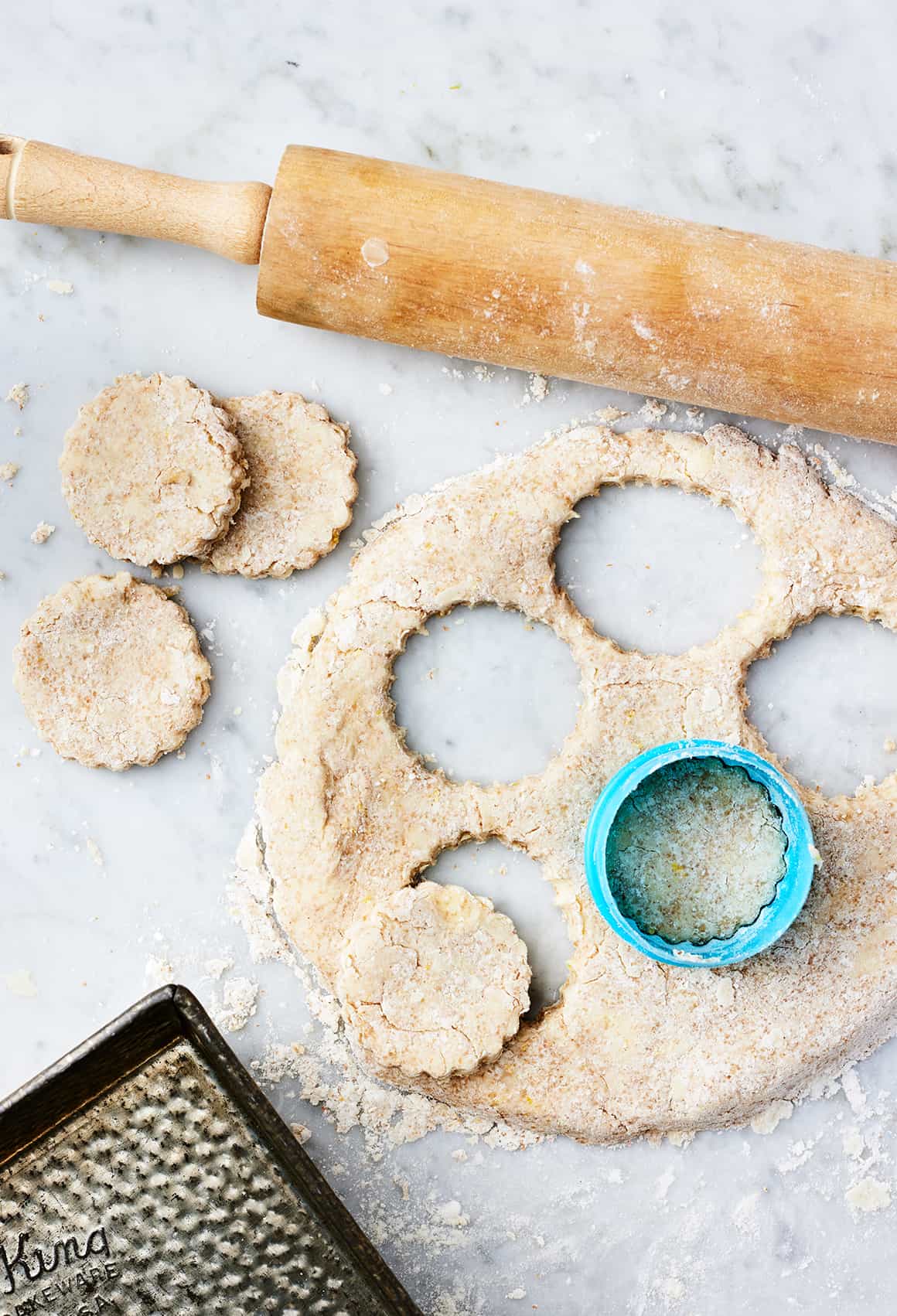 Biscuit dough with biscuits cut out