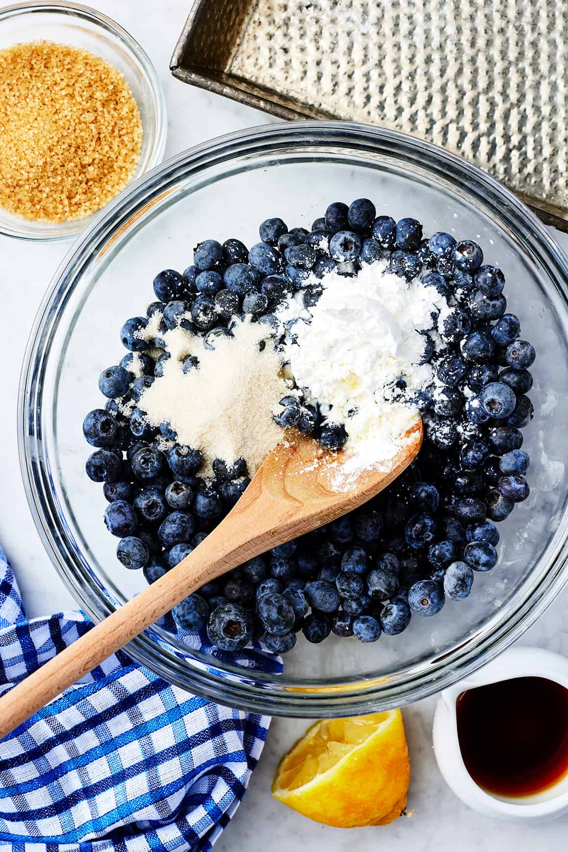 Blueberries, cornstarch, sugar, and lemon juice in a bowl