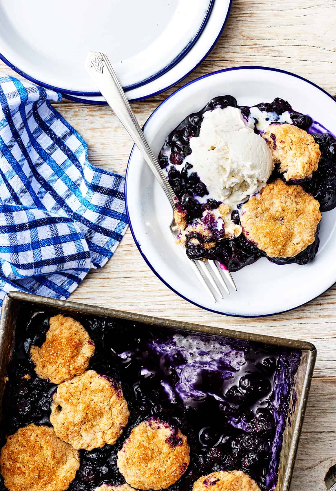 Blueberry cobbler with vanilla ice cream on plate