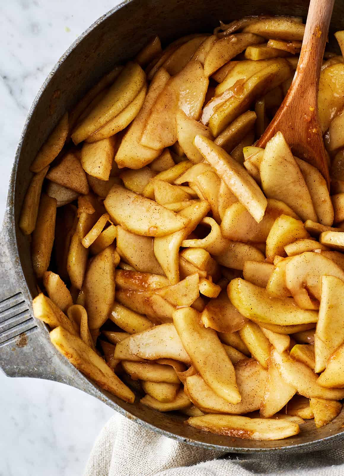 Cooked filling in a pot with wooden spoon