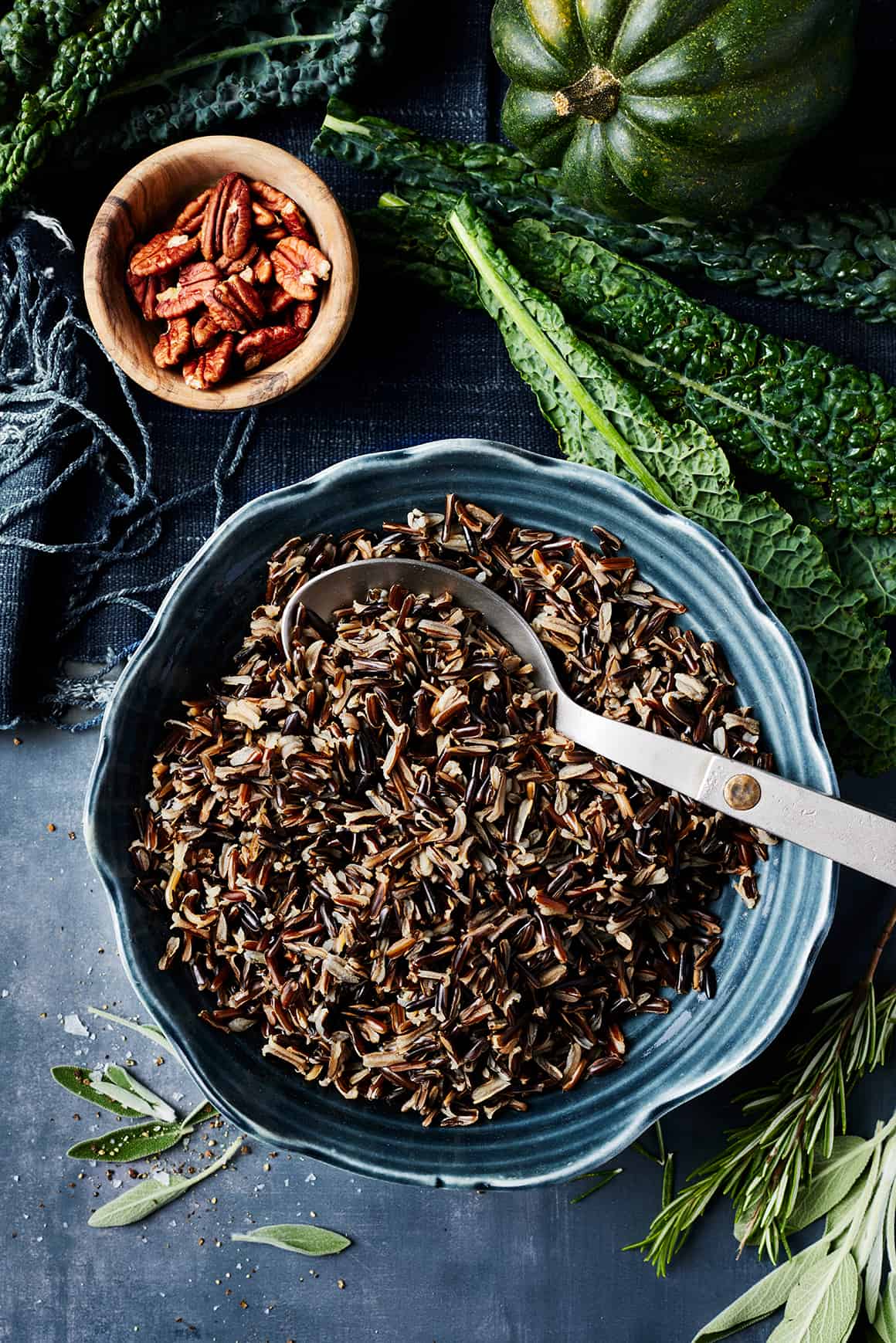 Wild rice in blue bowl with spoon