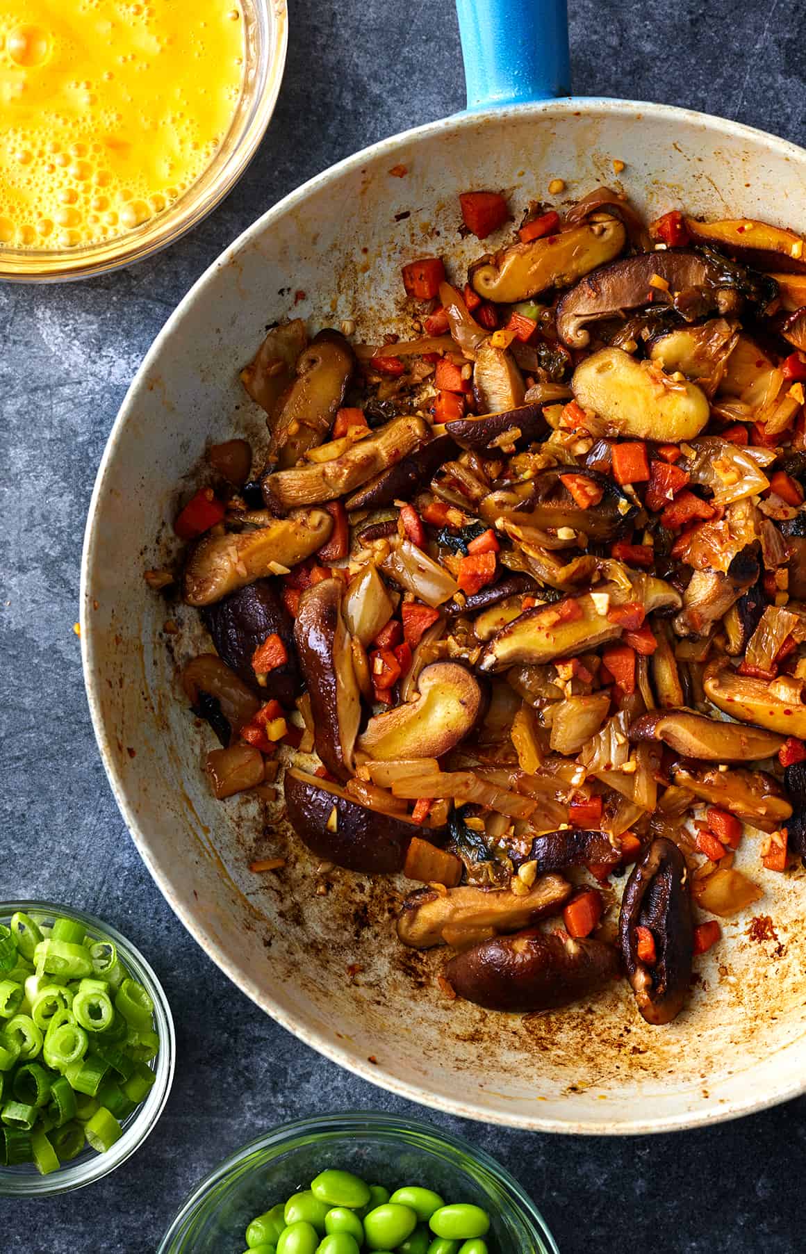Sauteed mushrooms and carrot in skillet