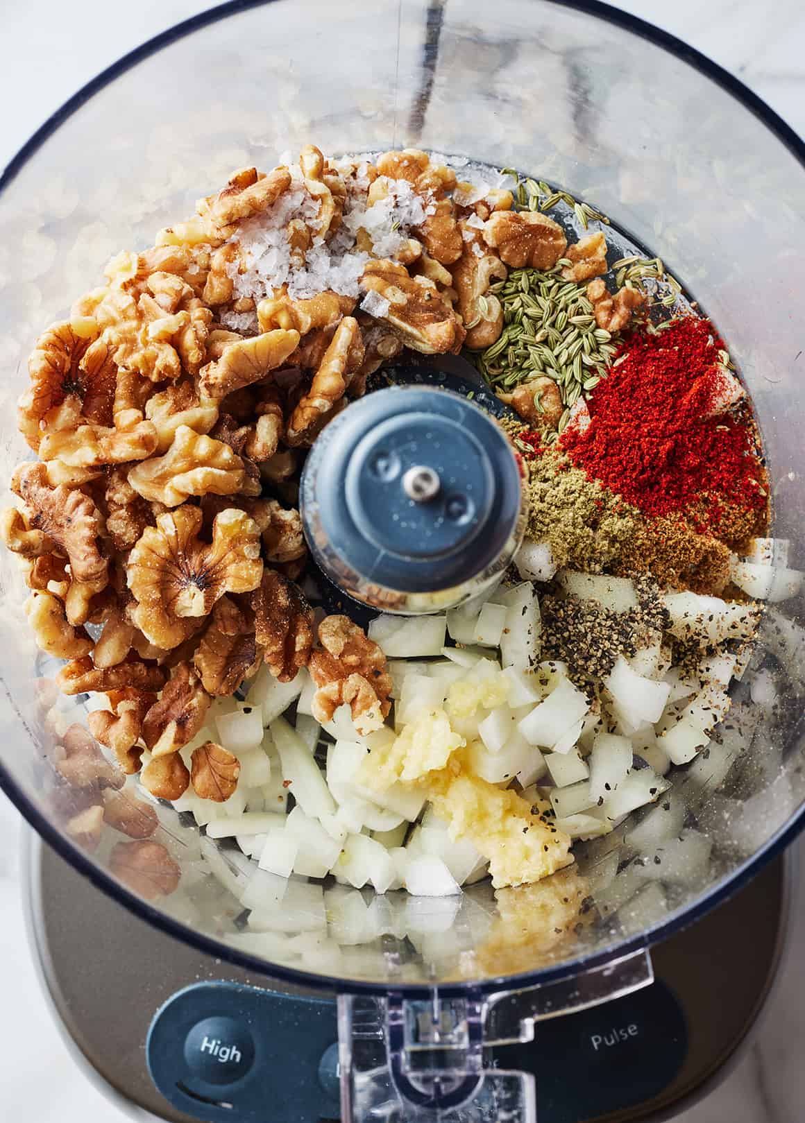 Walnuts, onion, garlic, salt, smoked paprika, cumin, pepper, ground sage, and fennel seed in a food processor