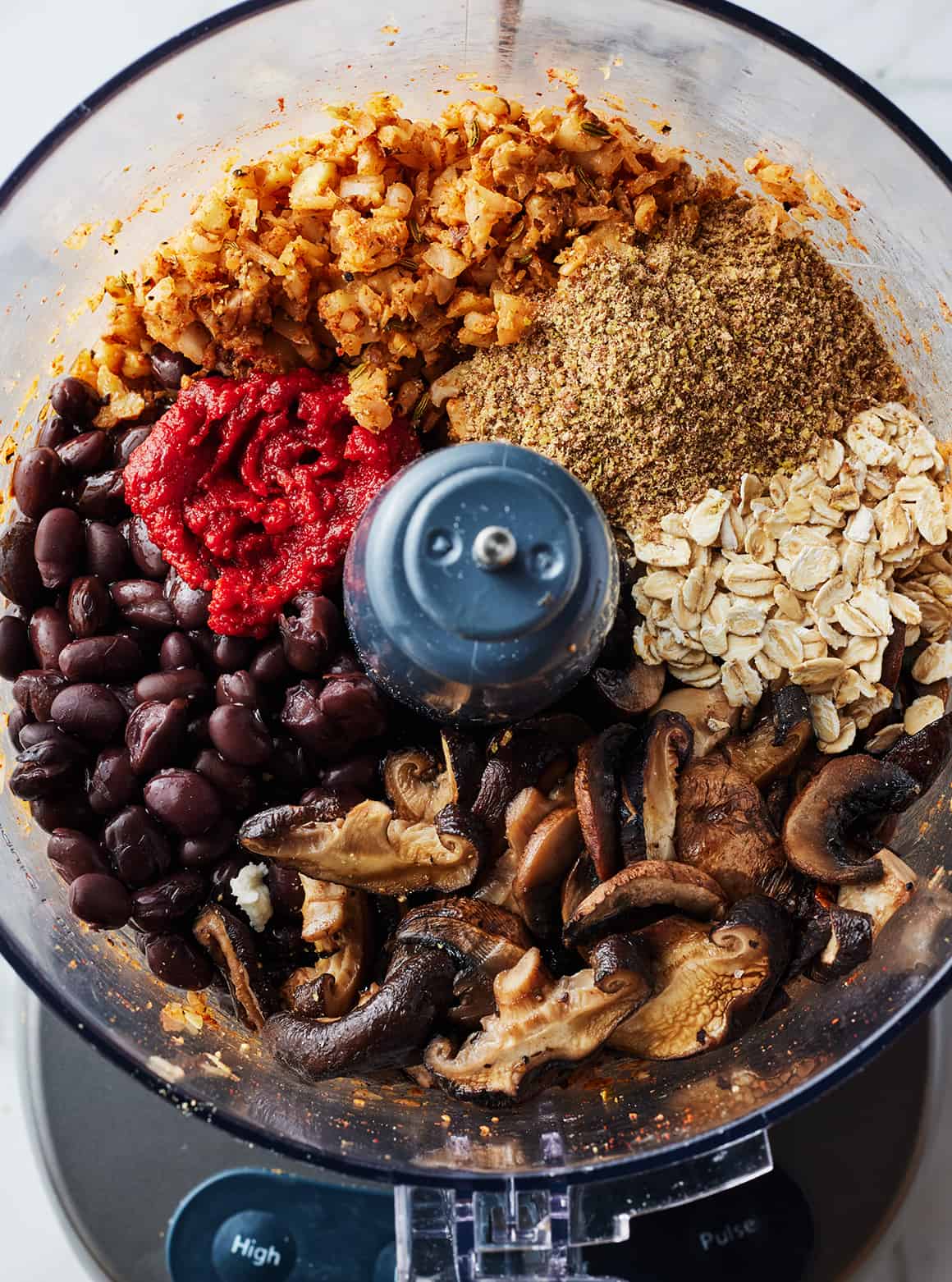 Vegan meatballs ingredients in a food processor
