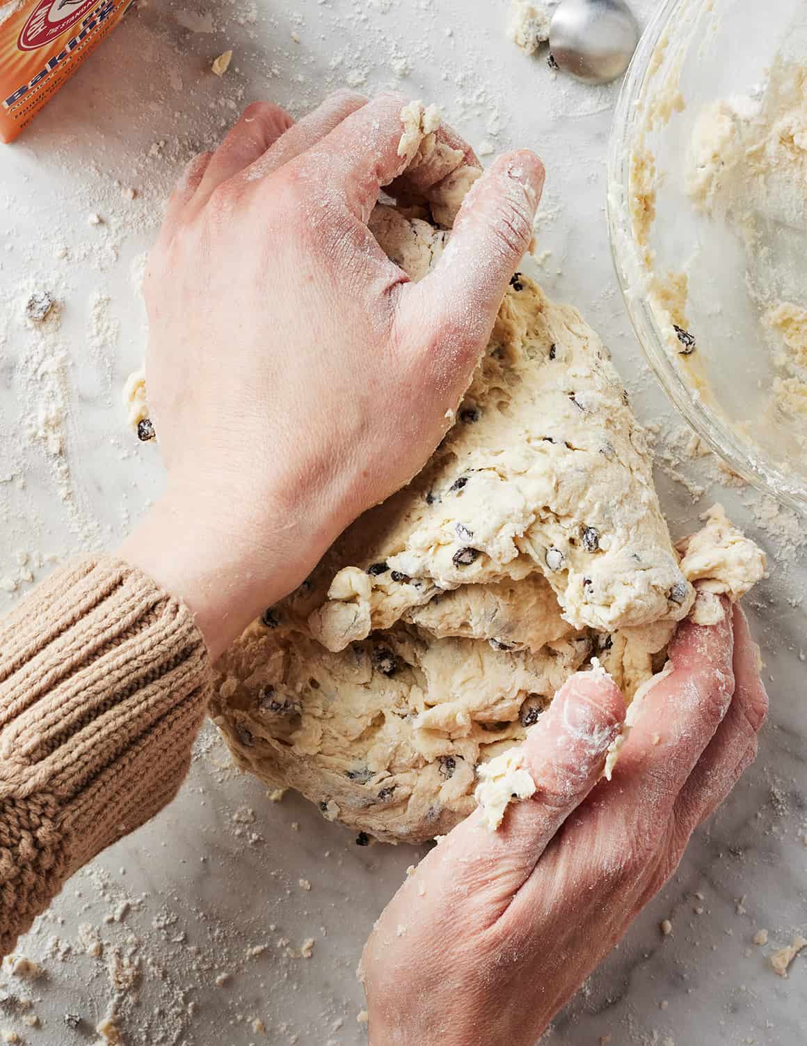 Hands kneading Irish soda bread dough