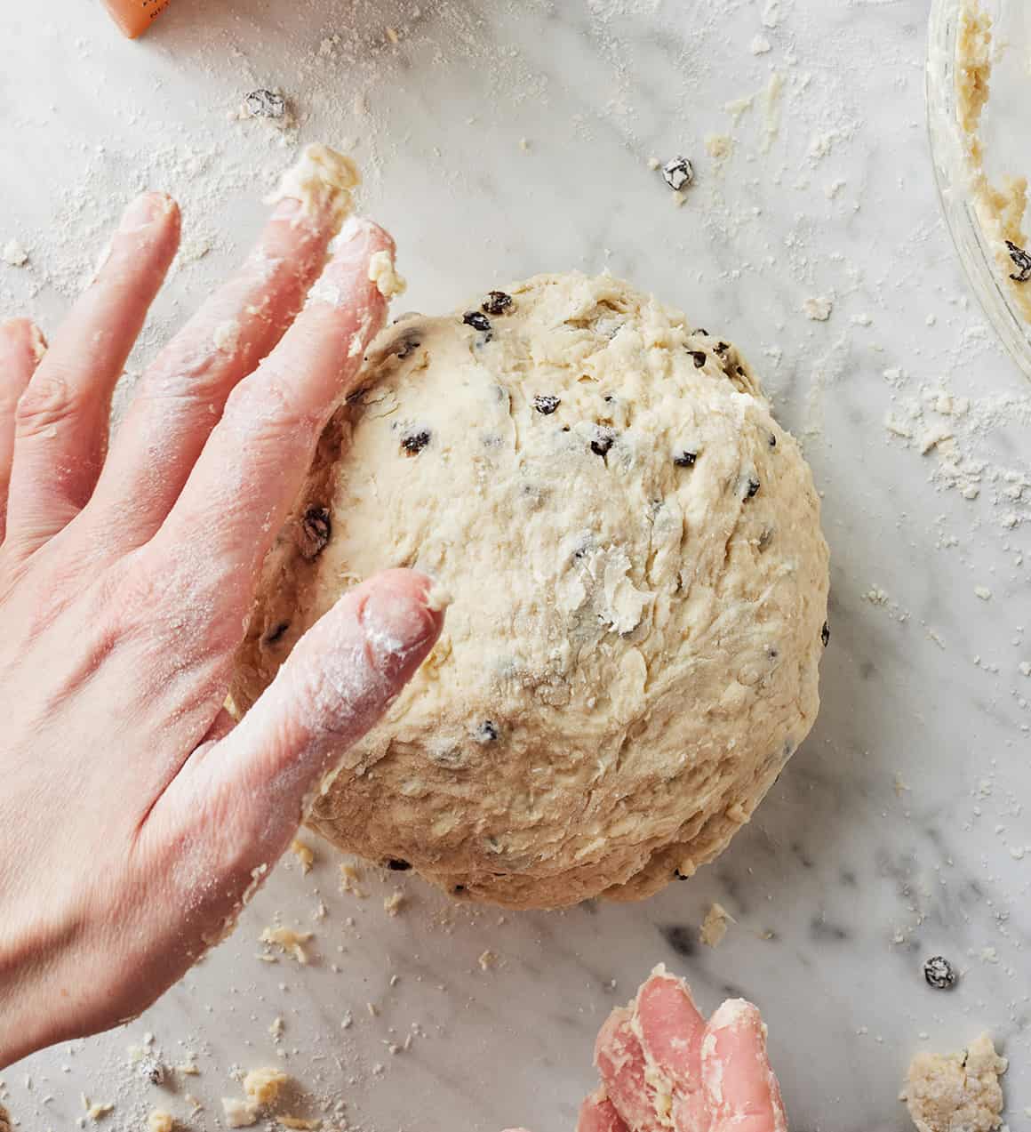 Hand shaping ball of Irish soda bread dough