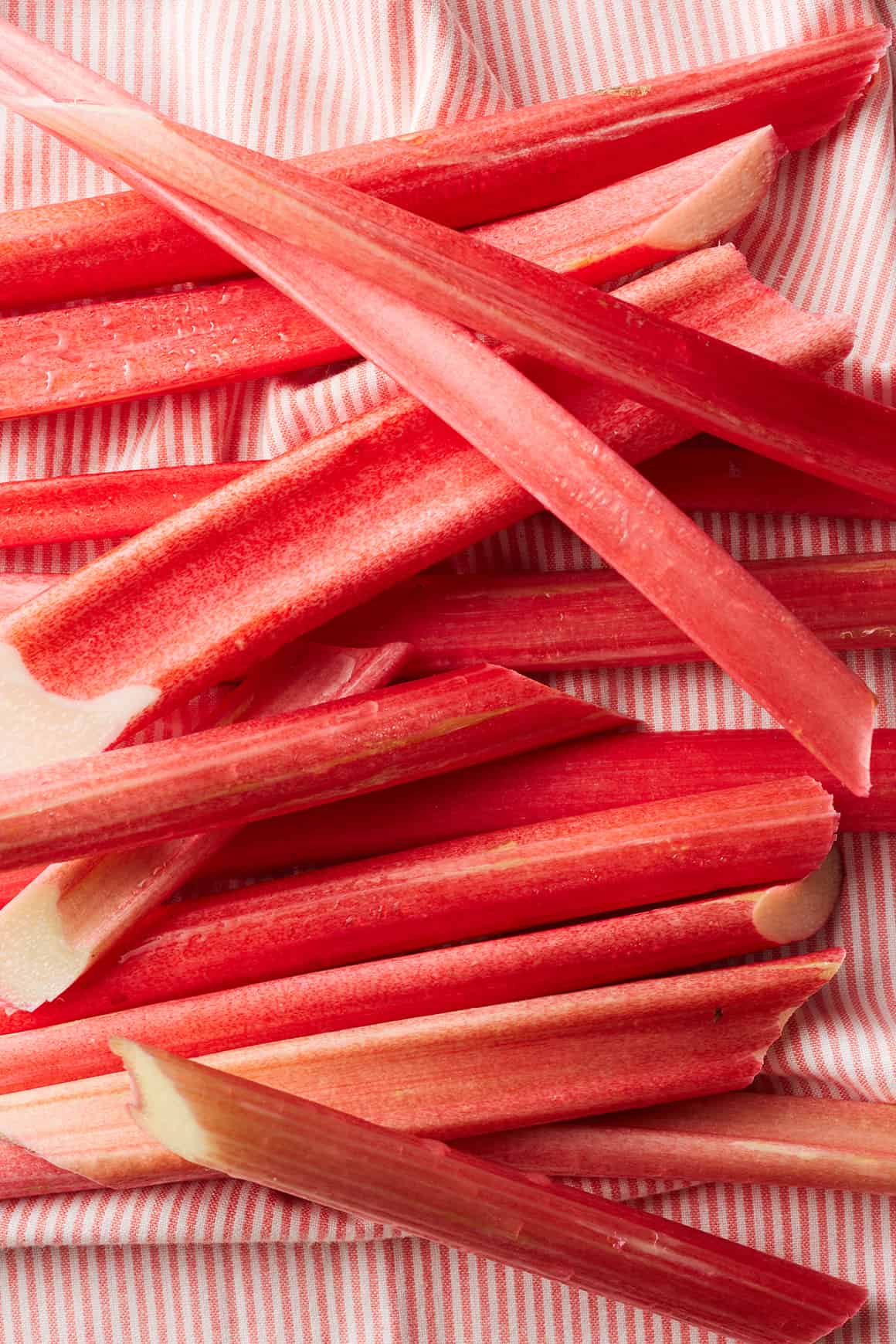 Rhubarb stalks on a kitchen towel
