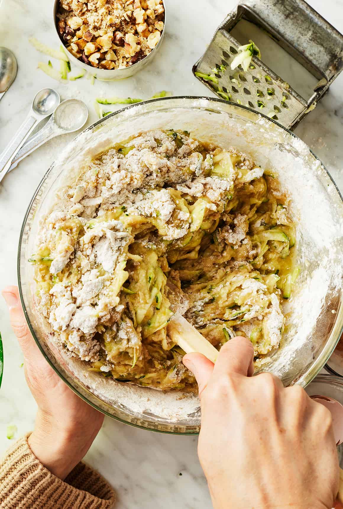 Mixing together wet and dry ingredients with spatula