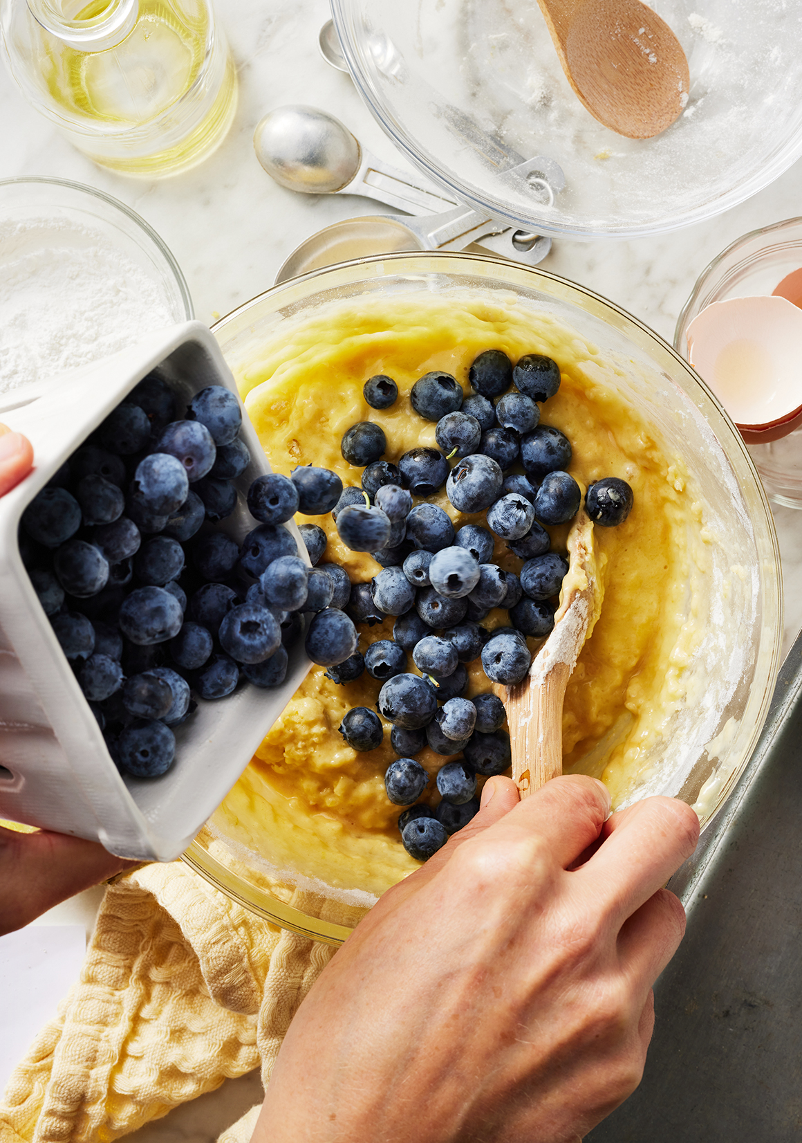 Folding blueberries into quick bread batter