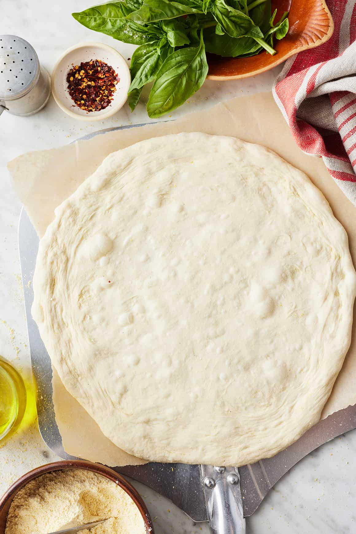 Pizza dough on a pizza peel