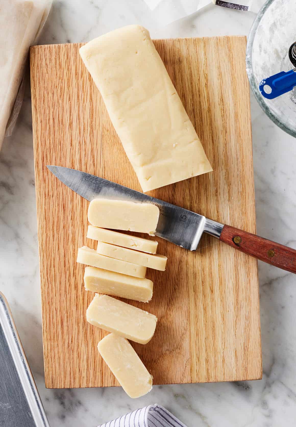 Slicing shortbread cookies from block of dough