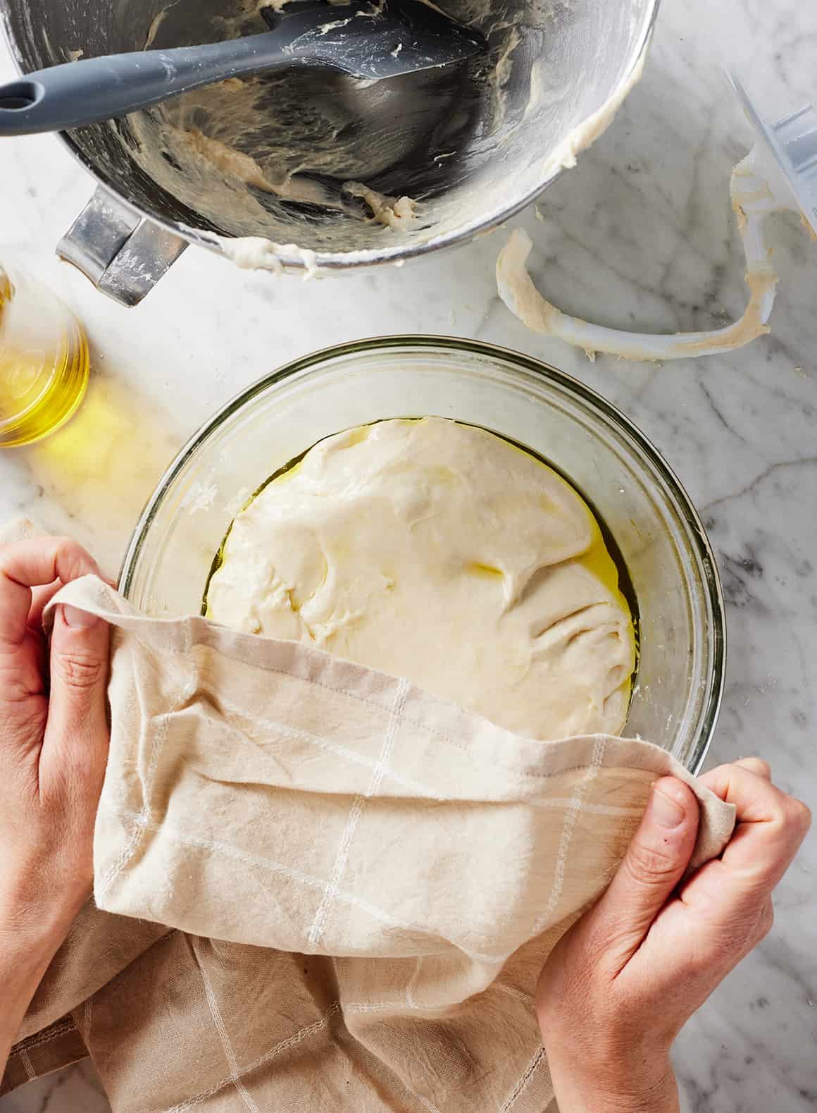 Covering bowl of dough with kitchen towel