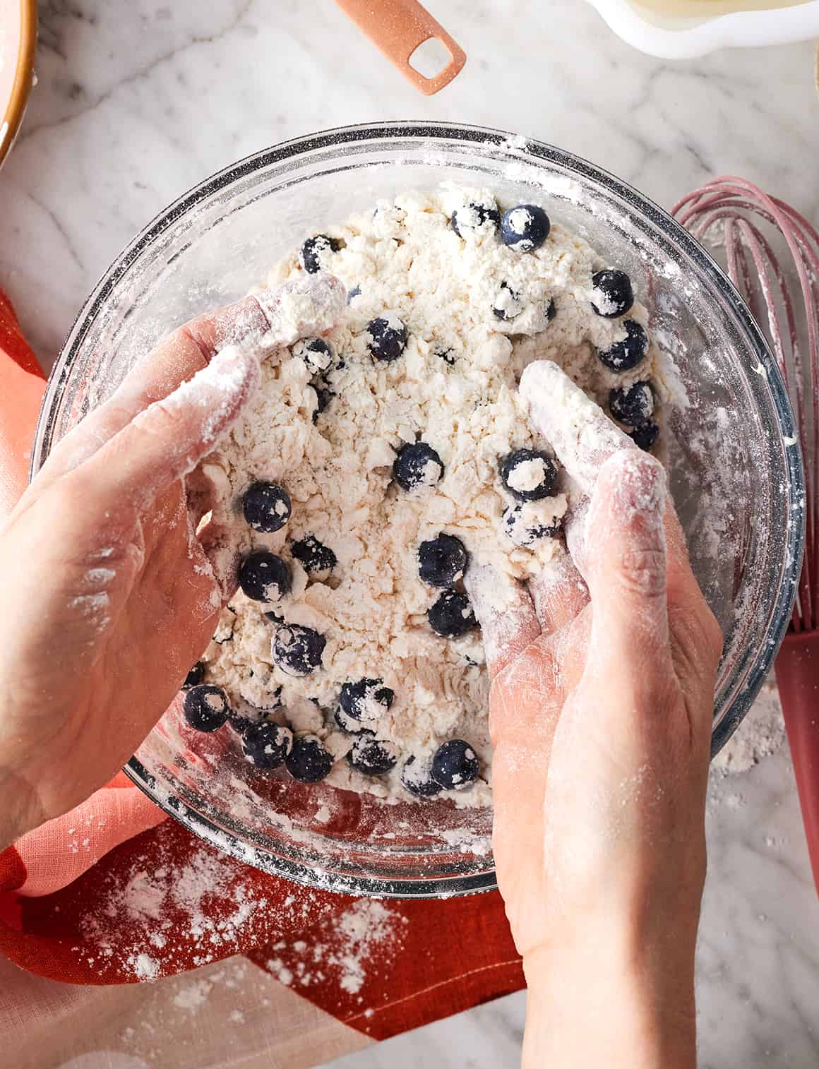 Tossing blueberries with butter and flour mixture