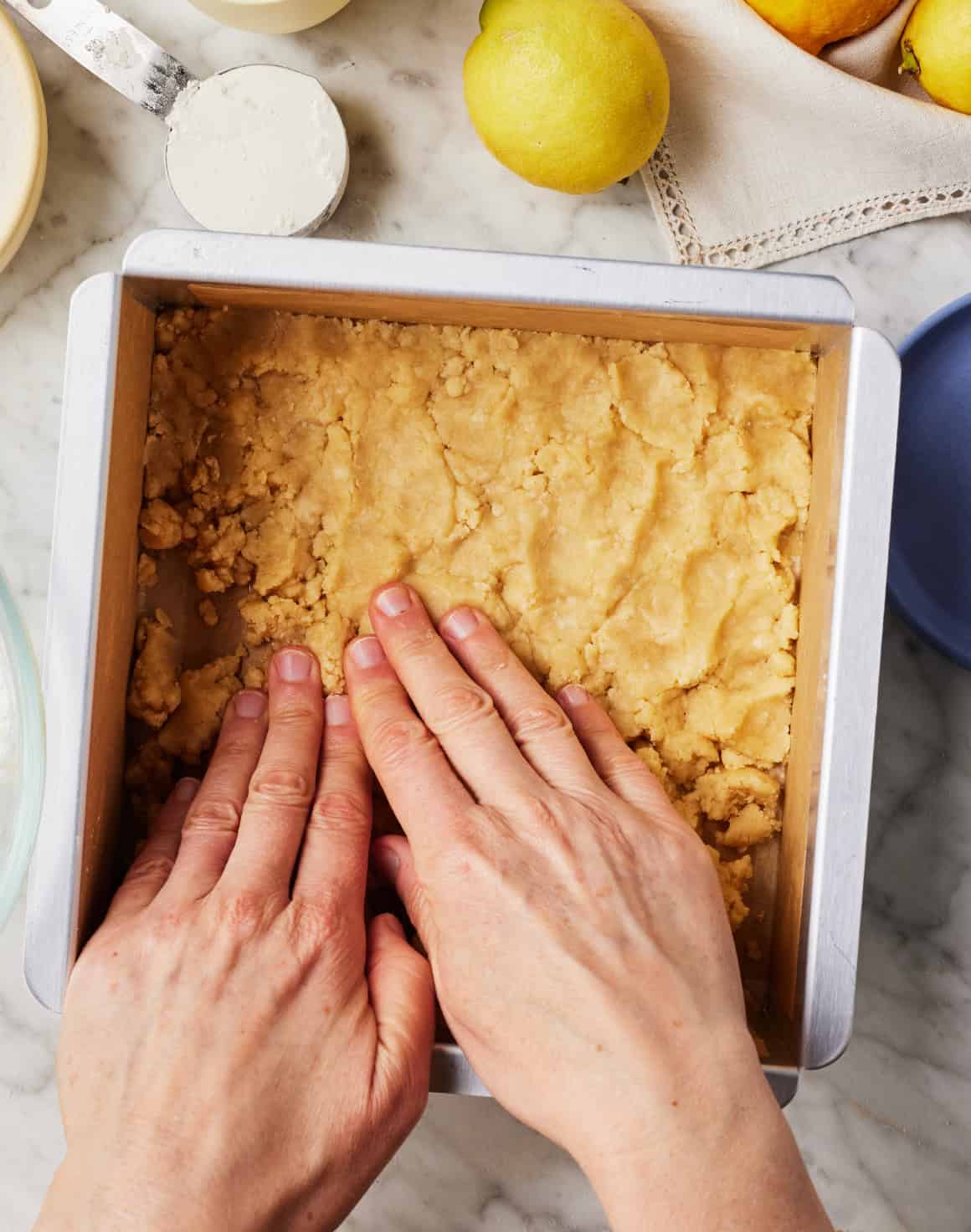 Pressing shortbread crust into pan
