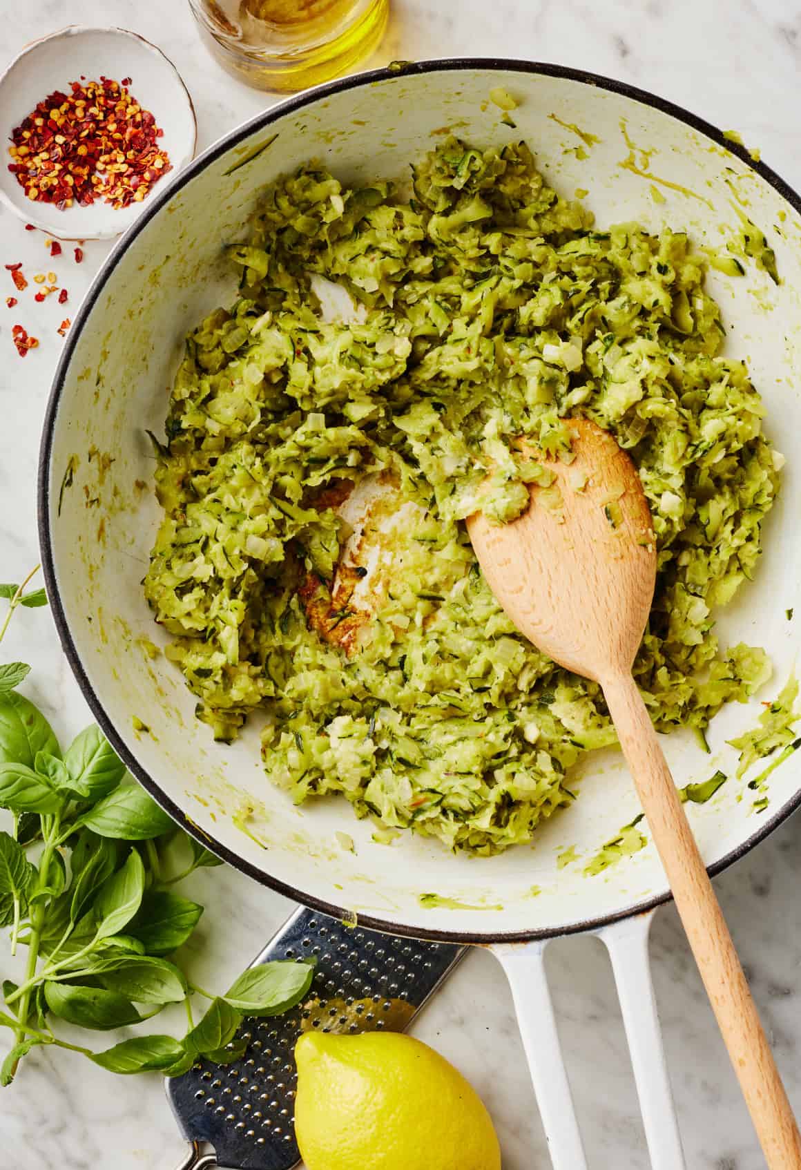 Cooking grated zucchini in skillet