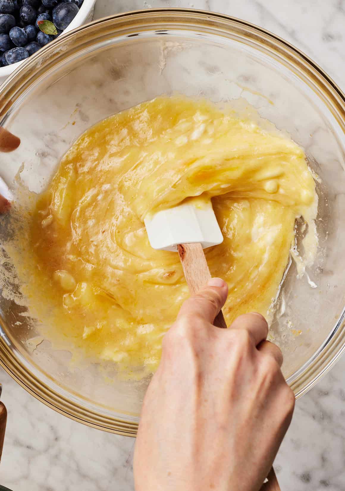 Mixing muffin batter with rubber spatula